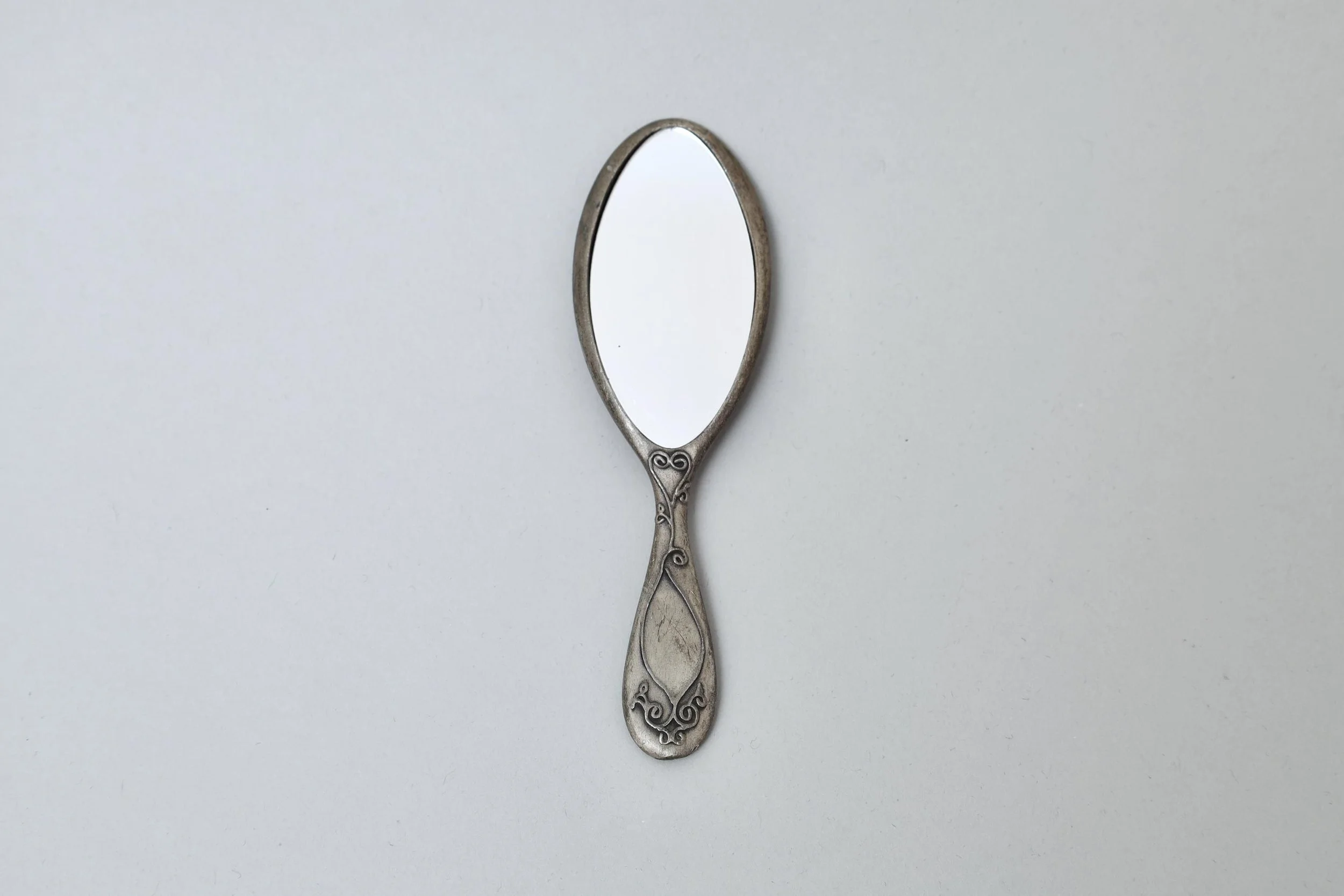 1990s Chantal Thomass decorative mini pewter hand mirror