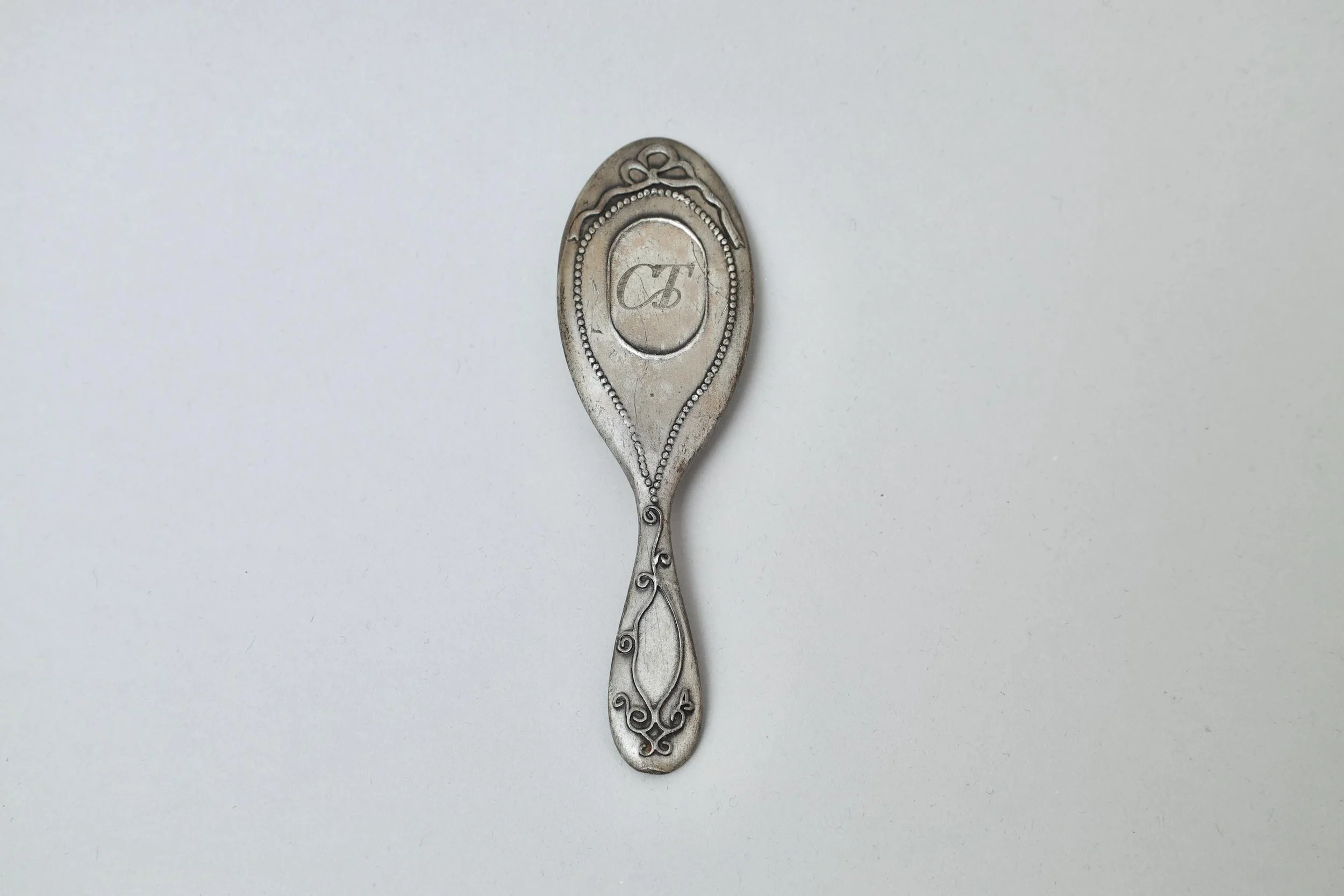 1990s Chantal Thomass decorative mini pewter hand mirror