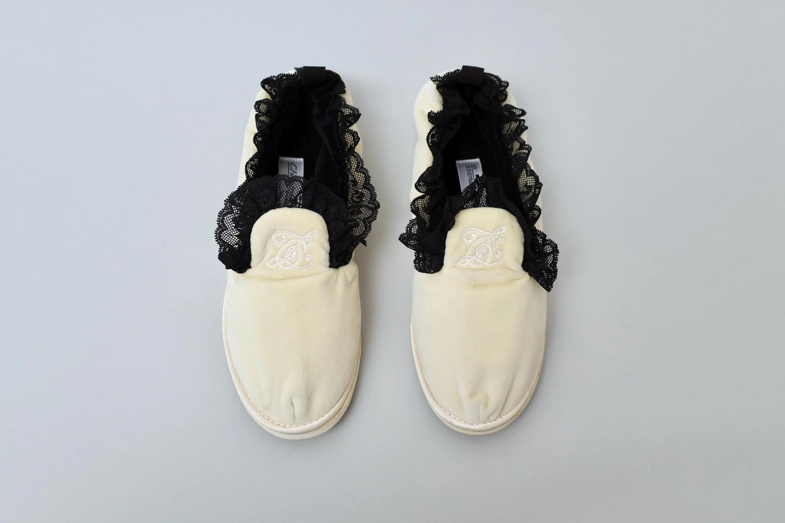 1990s deadstock Chantal Thomass cream velvet and black lace house slippers