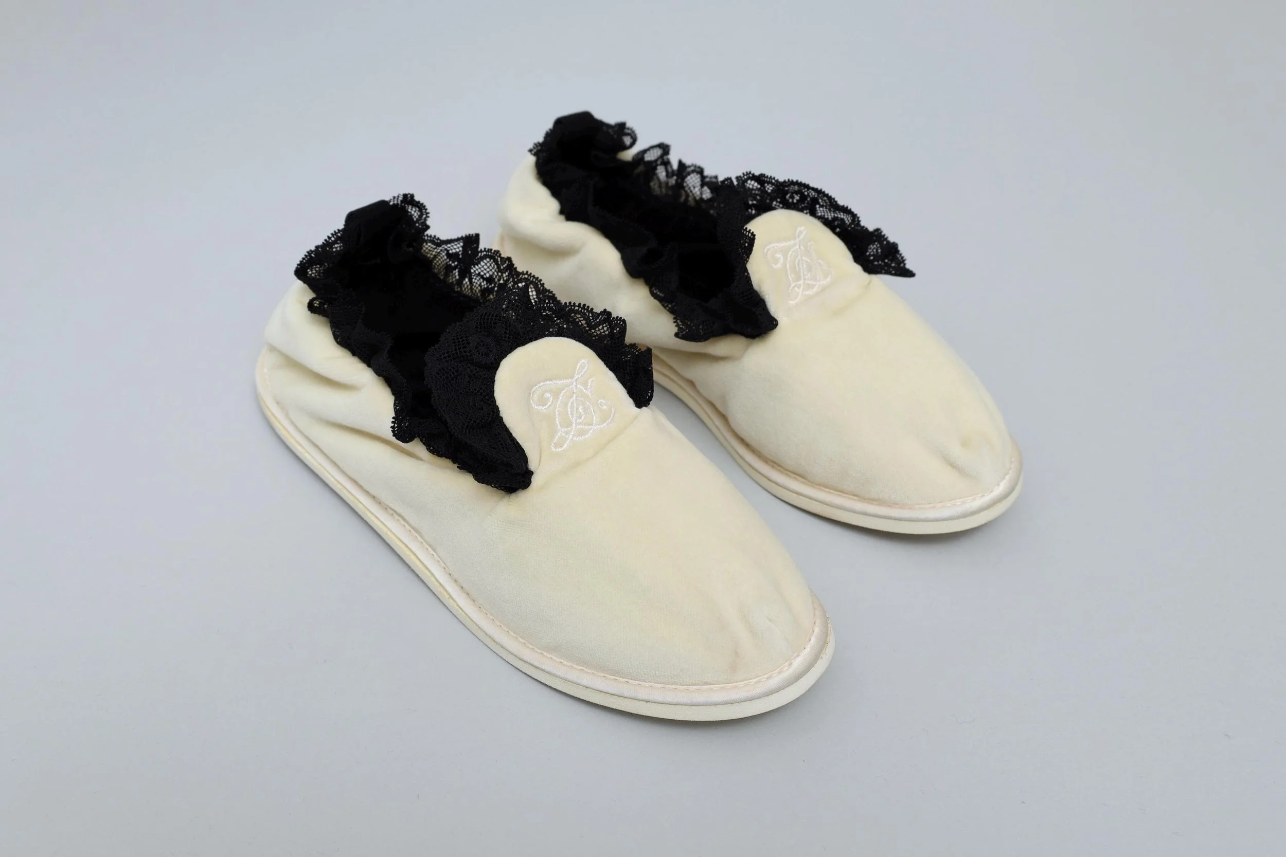 1990s deadstock Chantal Thomass cream velvet and black lace house slippers