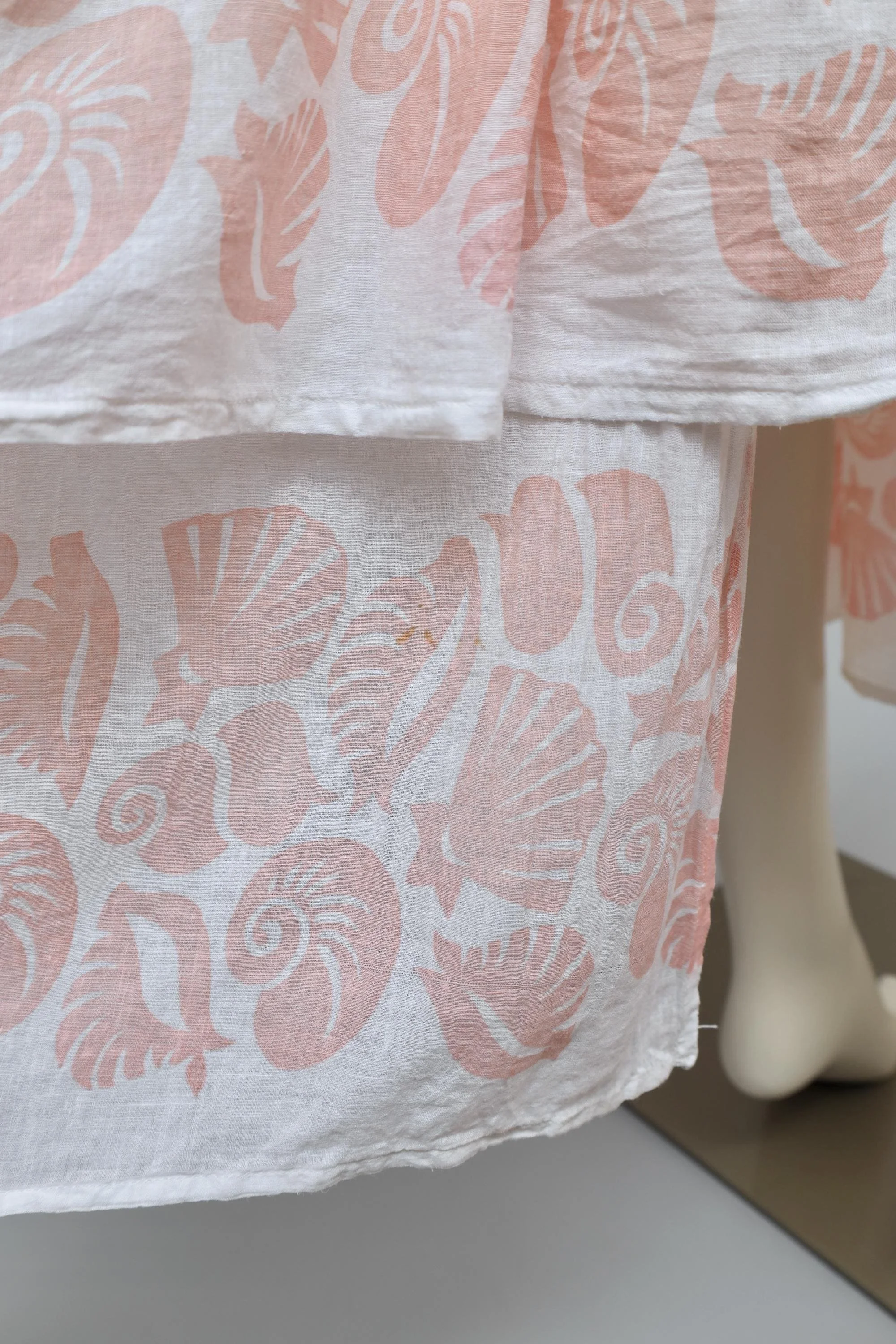 coral seashells on cotton gauze