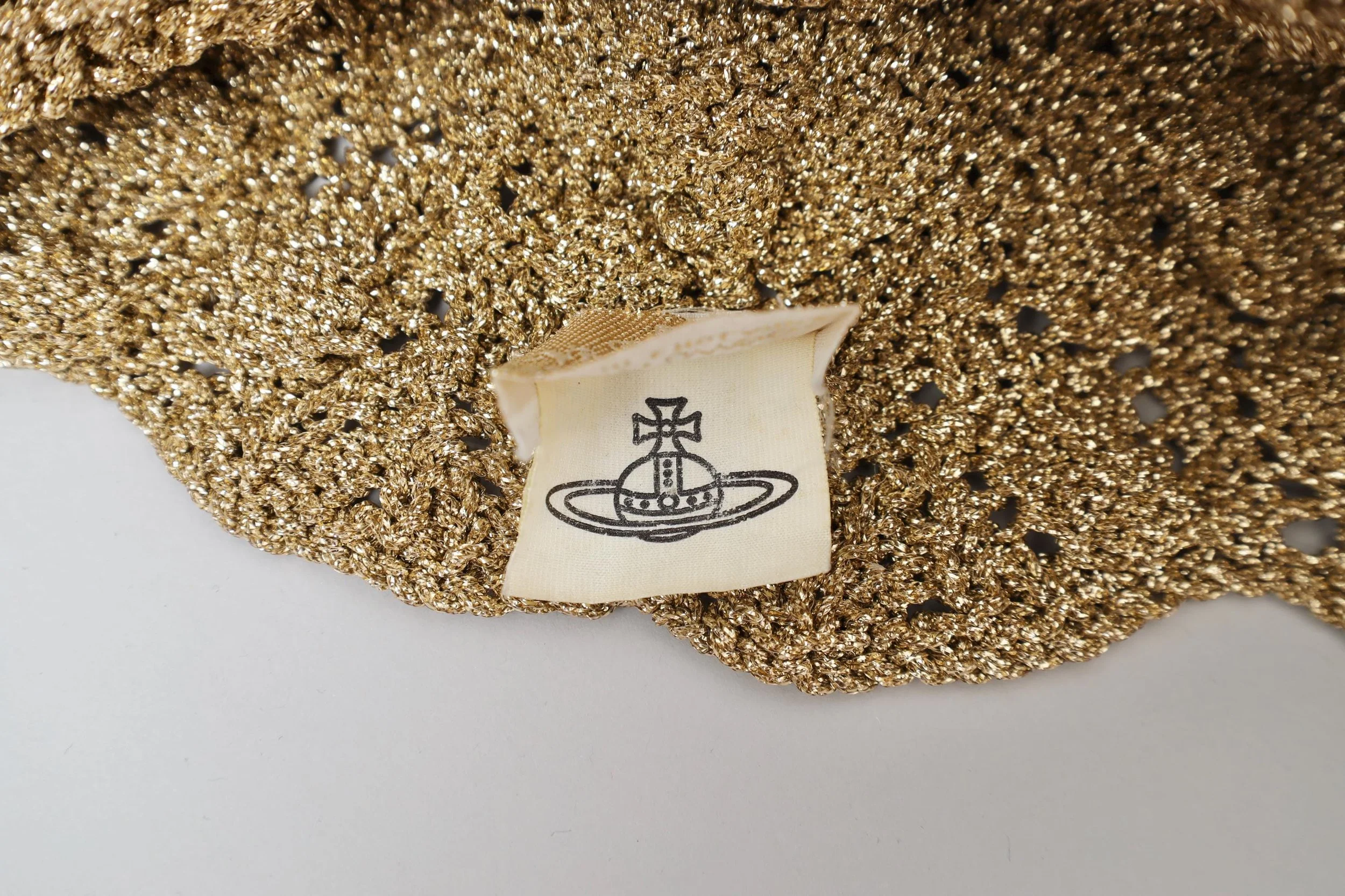 F/W 1993 Vivienne Westwood metallic gold lurex peruvian cap label tag