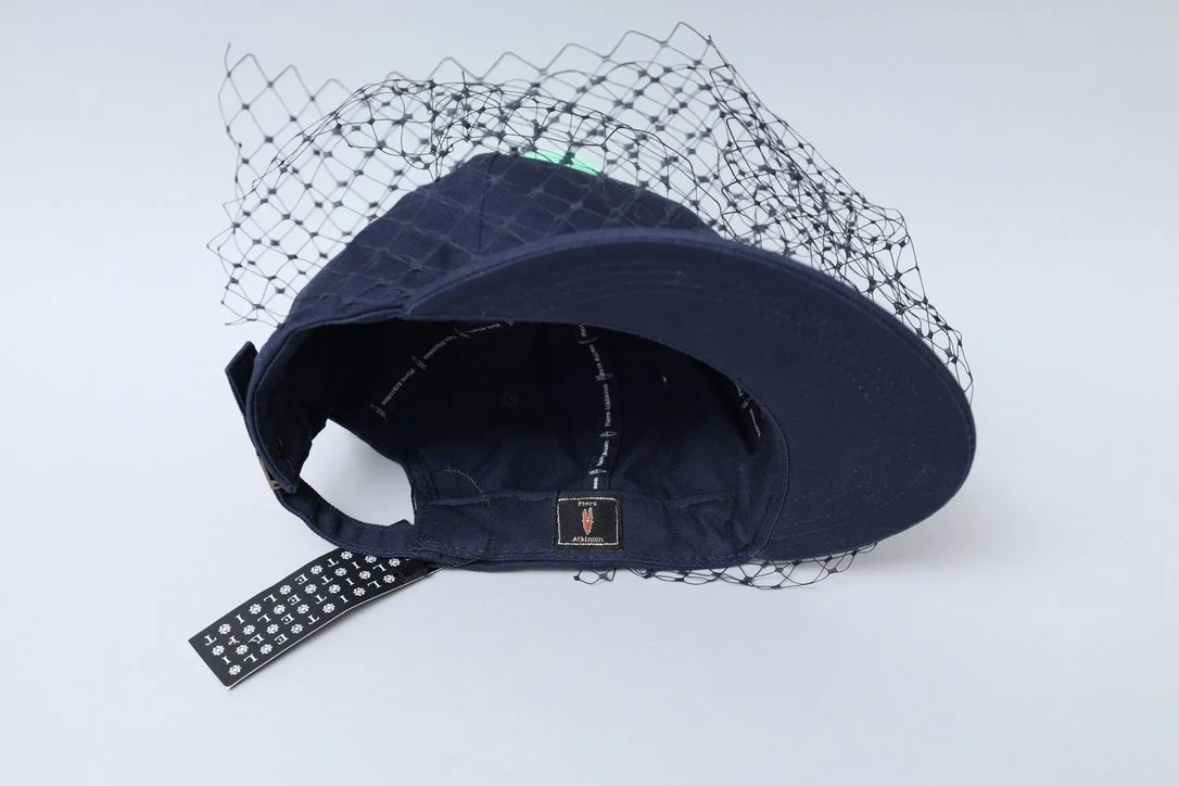 S/S 2016 Piers Atkinson navy blue veil baseball cap with acid green pom pom