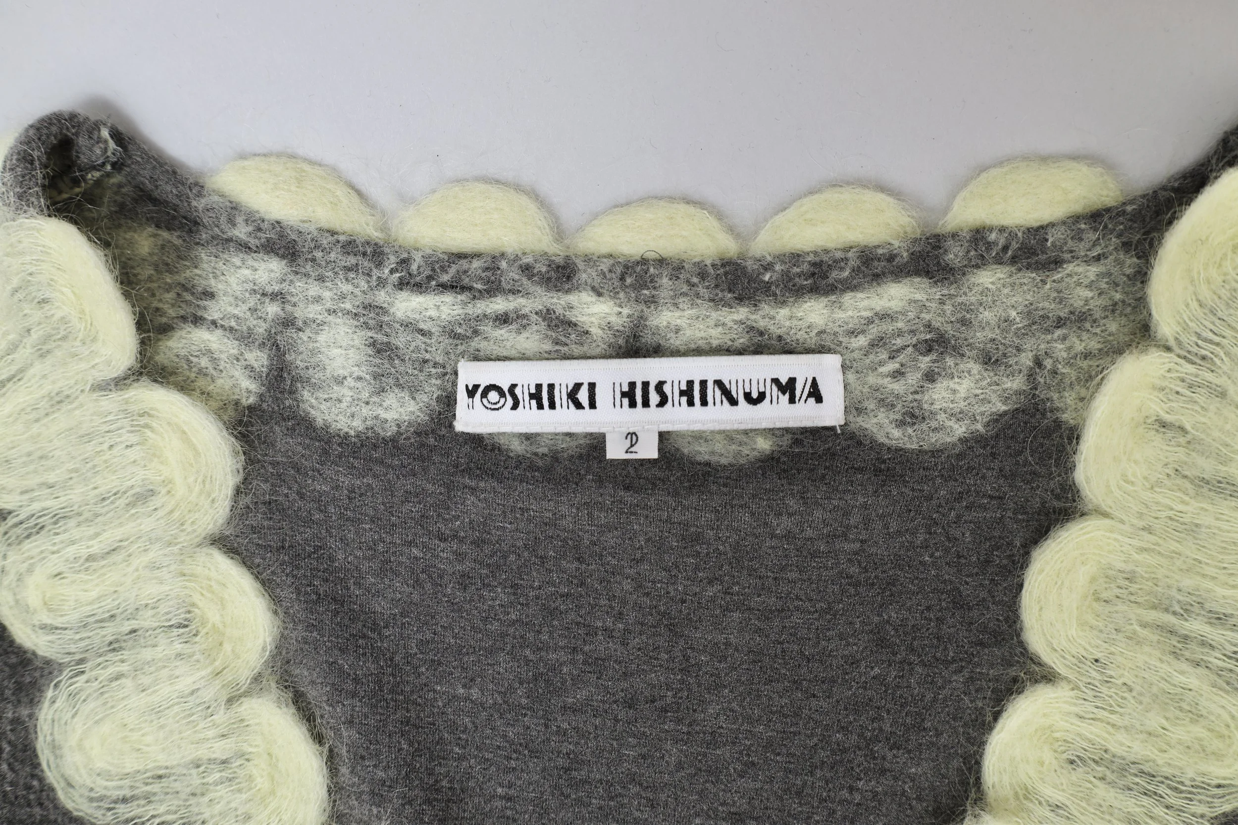 2000s Yoshiki Hishinuma gray fleece and pale yellow mohair label tag
