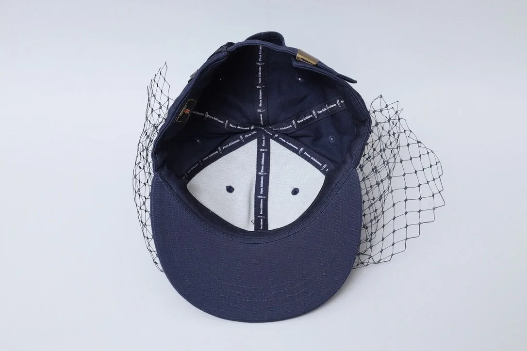 S/S 2016 Piers Atkinson navy blue veil baseball cap with acid green pom pom