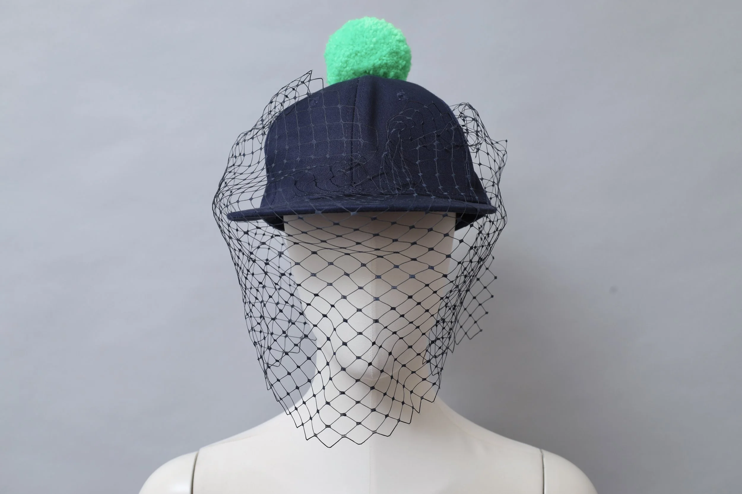 S/S 2016 Piers Atkinson navy blue veil baseball cap with acid green pom pom