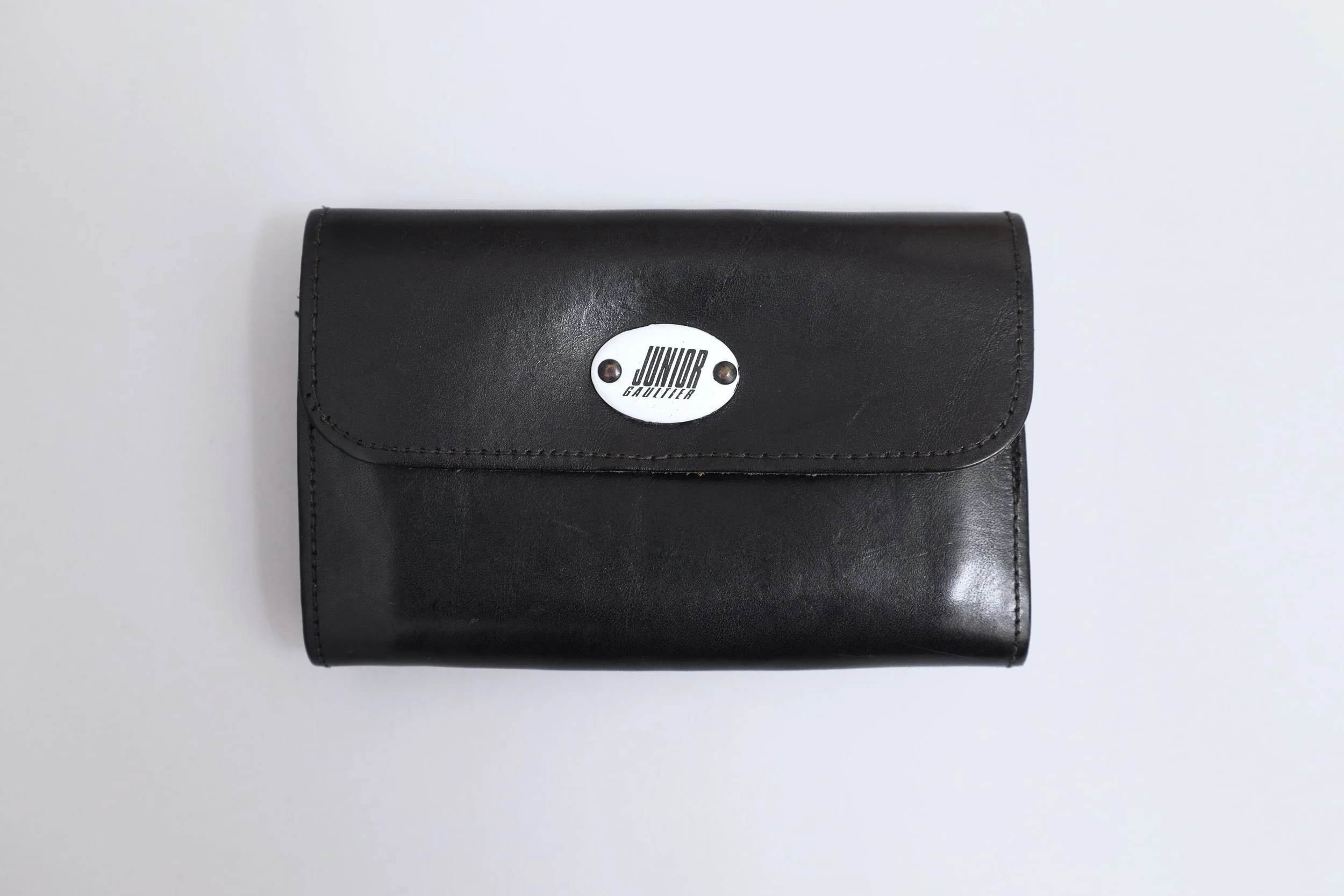 1980s Junior Gaultier enamel tag black leather wallet