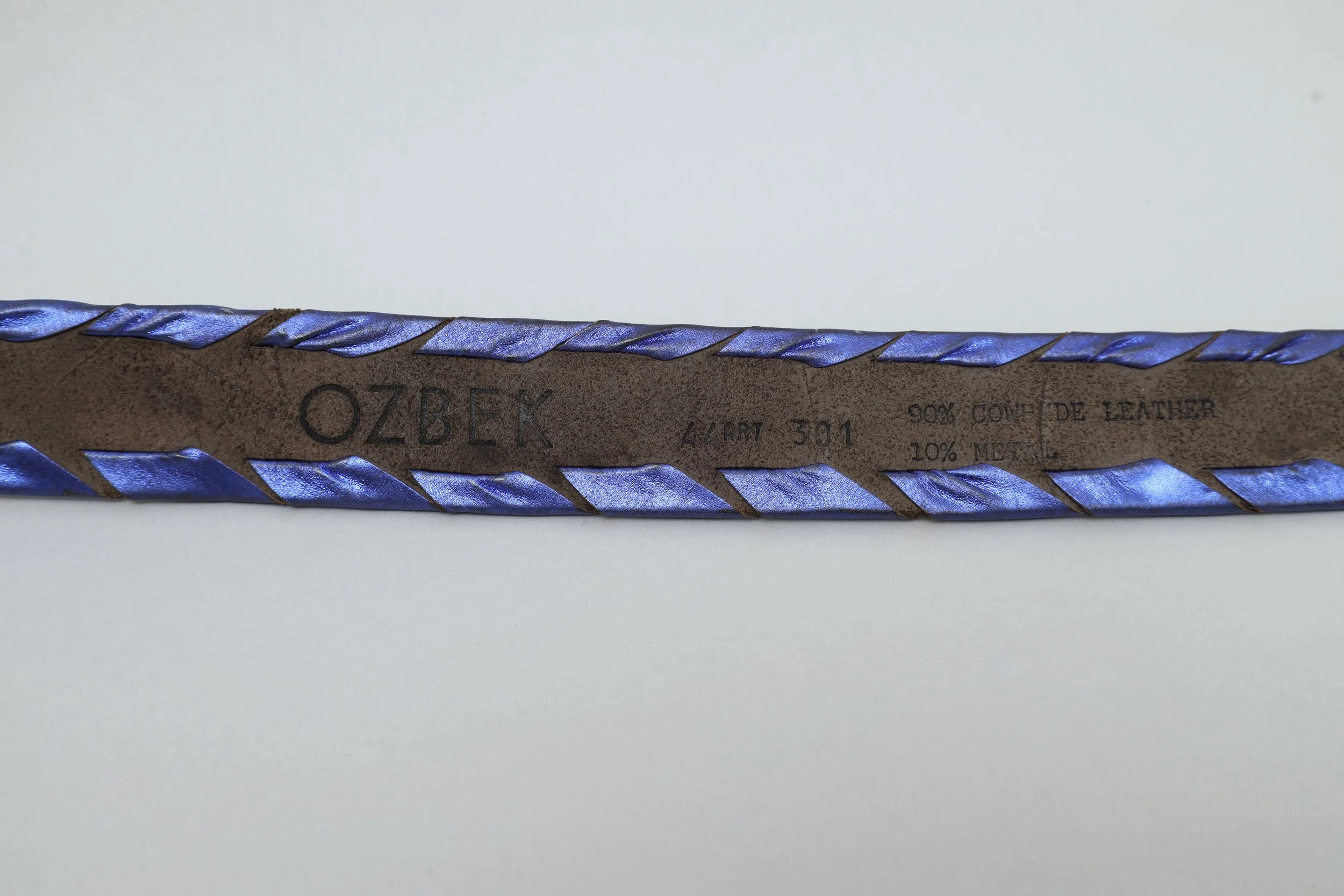 1990s Rifat Ozbek art deco metallic leather belt logo