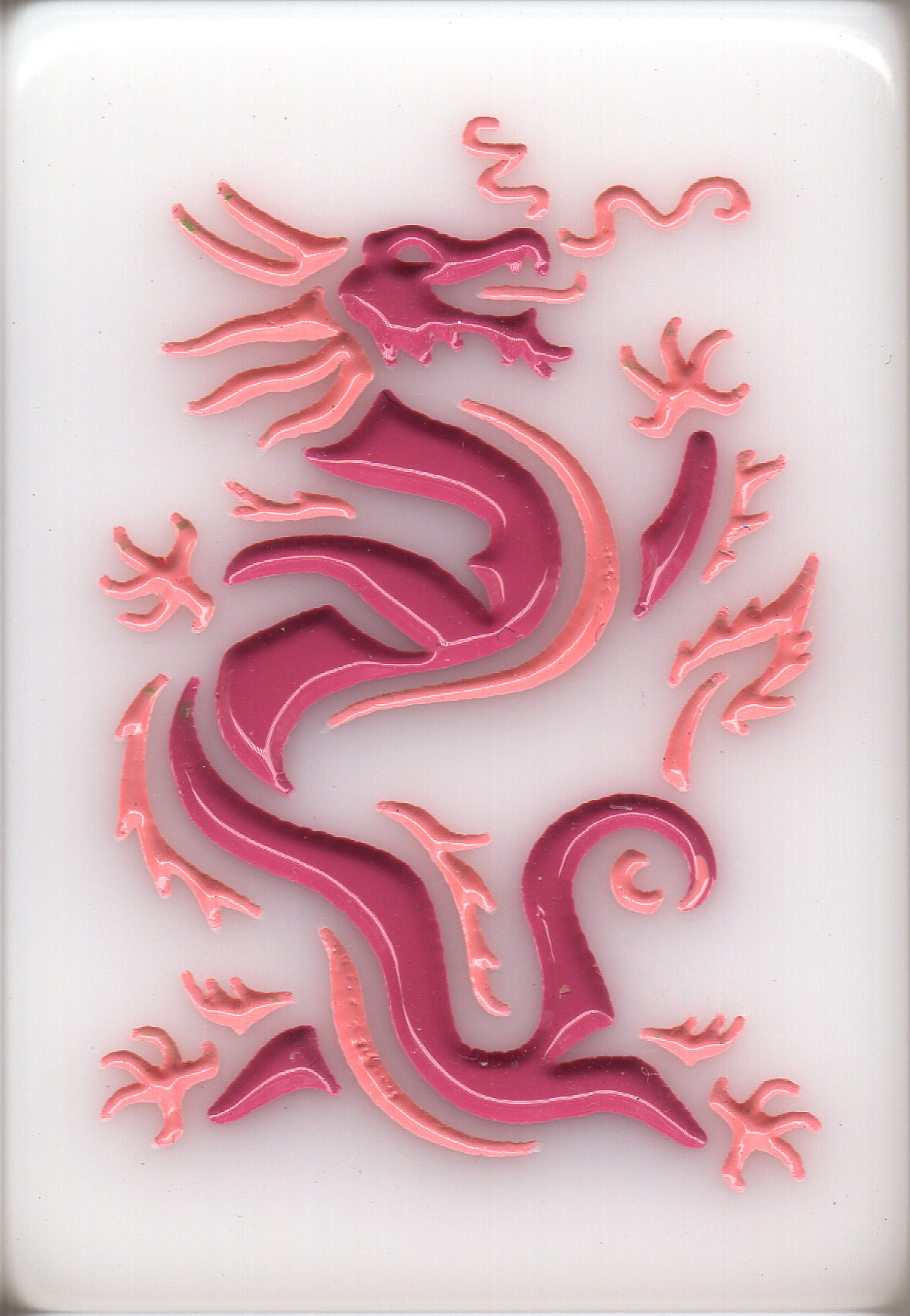 Plastic neon sign shaped like a dragon in pink and purple colors on a white background.