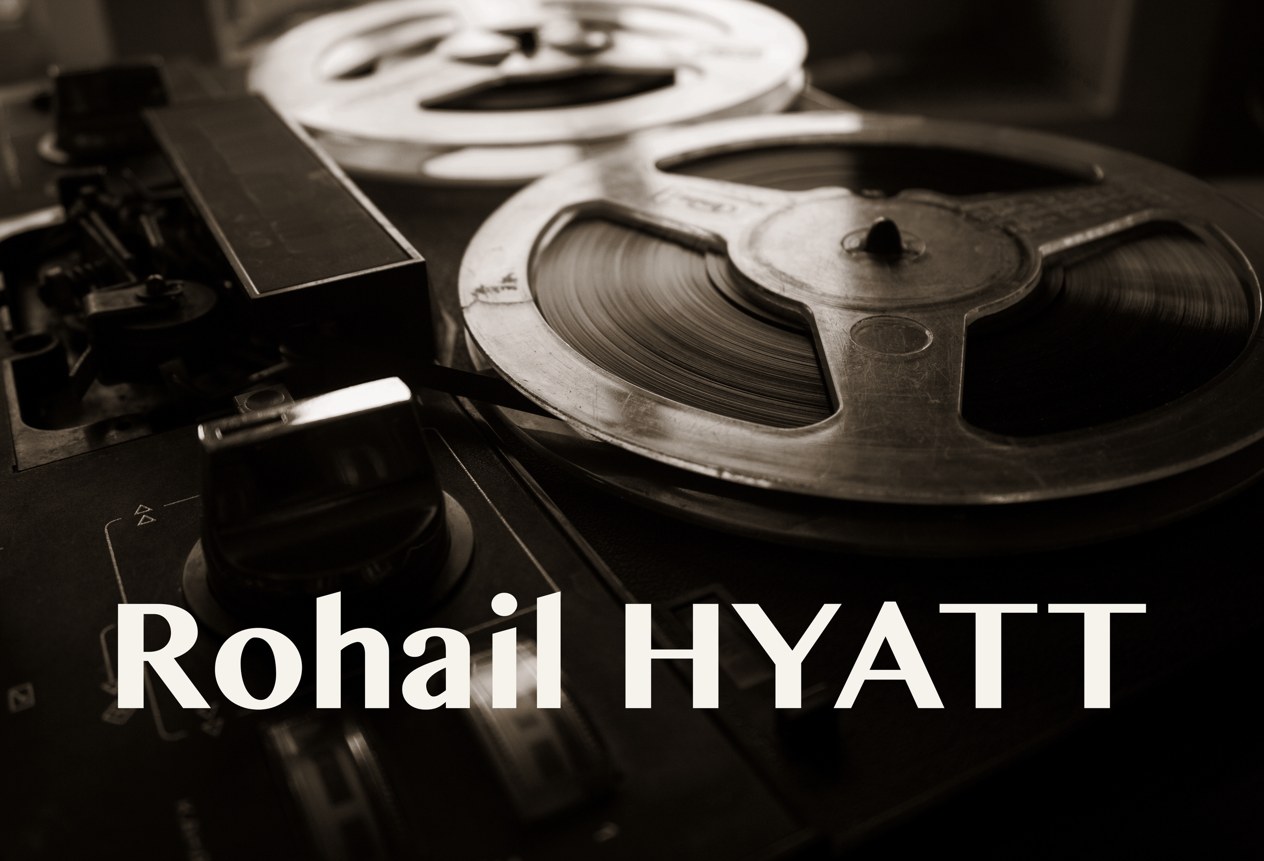 Close-up of a vintage reel-to-reel tape recorder with a person's name, Rohit THAT, overlaid at the bottom.