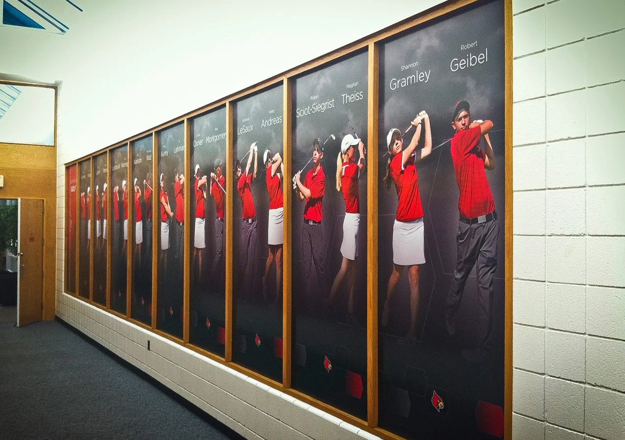 Wall graphics for University of Louisville Athletics. Frosting Creative Co. can use environmental graphics design to help you organization reach its goals.
