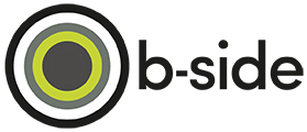 A logo with a circular design and the text 'b-side' next to it.