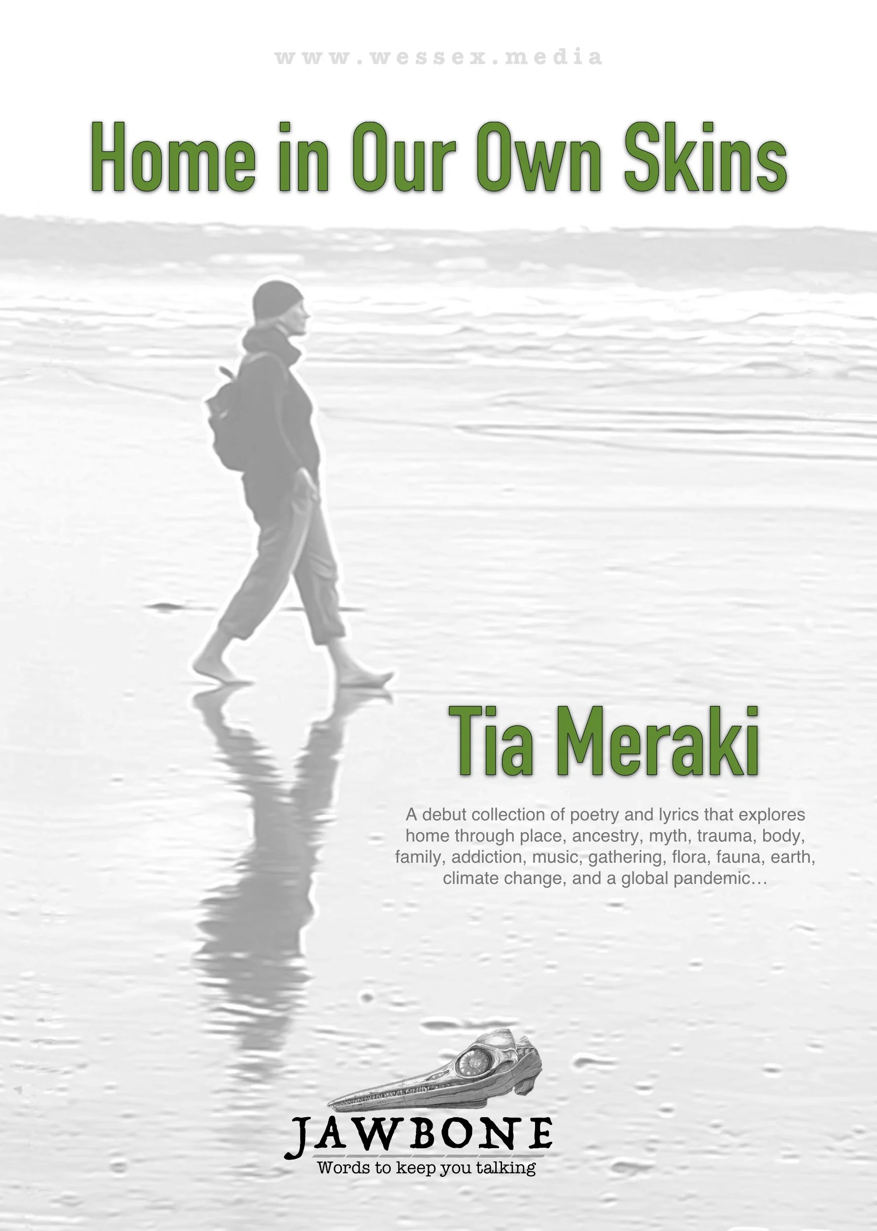 Book cover titled 'Home in Our Own Skins' by Tia Meraki. Features a black and white photo of a person walking on the beach, with the ocean in the background. Contains a subtitle about poetry and lyrics exploring themes like home, place, ancestry, trauma, family, and global issues, with a focus on words to keep talking.