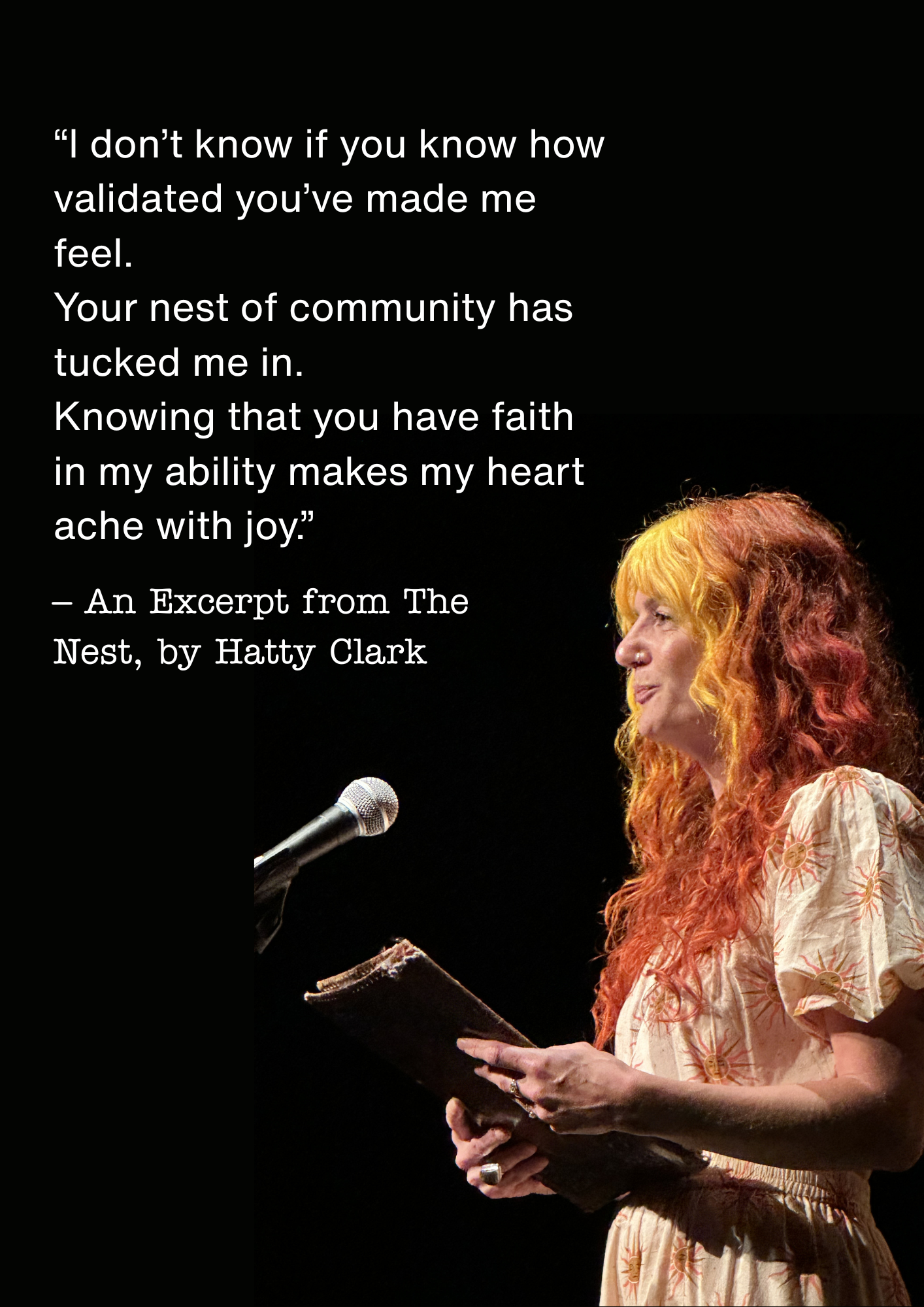 A woman with curly orange hair speaking into a microphone while reading from a script in her hand, wearing a light-colored dress with a sunburst pattern.