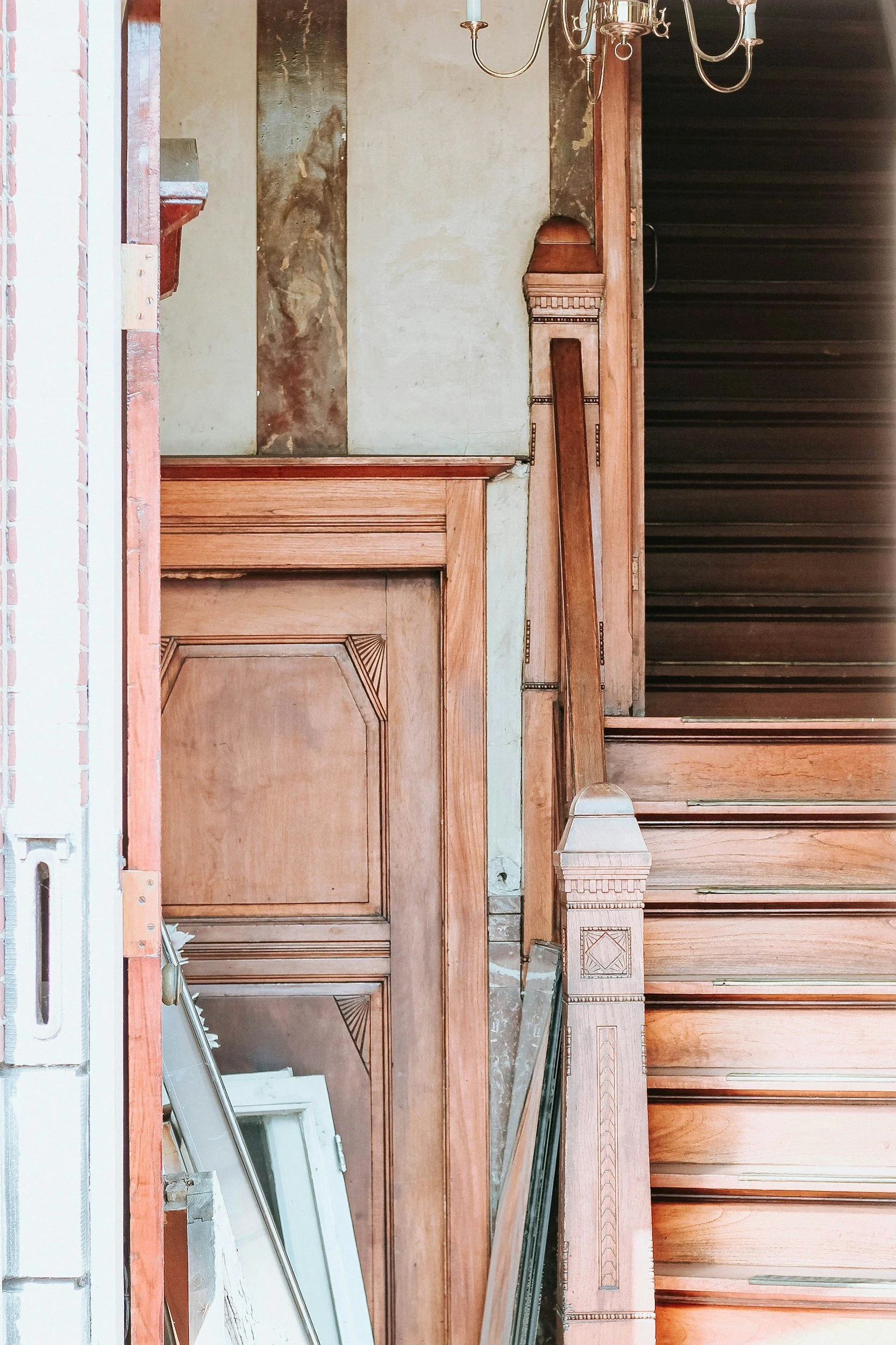 Restored architectural woodwork, door and staircase in a historic interior