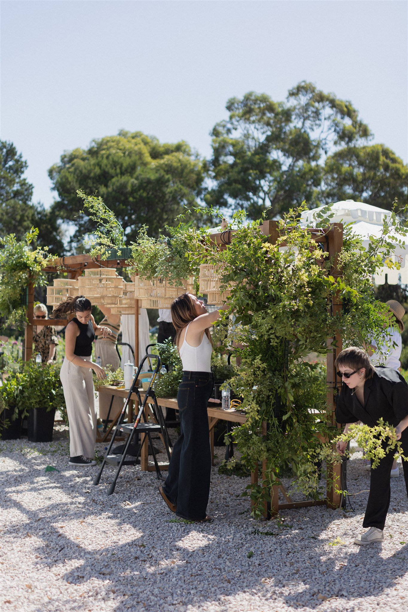 Blume Retreat attendees creating a large-scale floral installation at Blume Estate