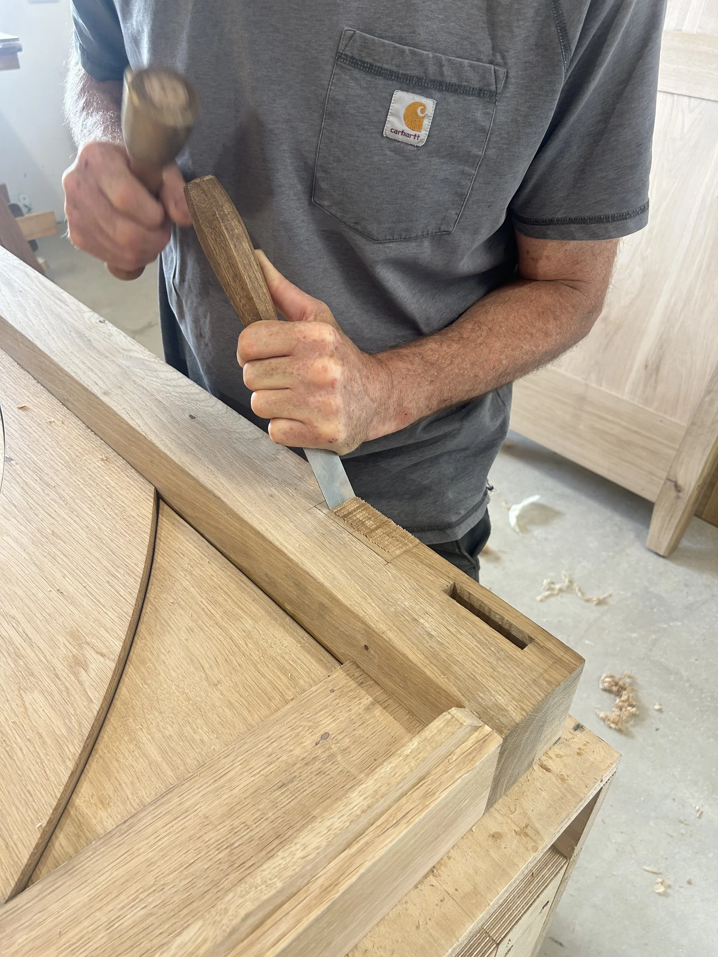 Hand cutting a hinge recess on the oak vestry wardrobe, Bayfolk Furniture workshop, Robin Hood's Bay