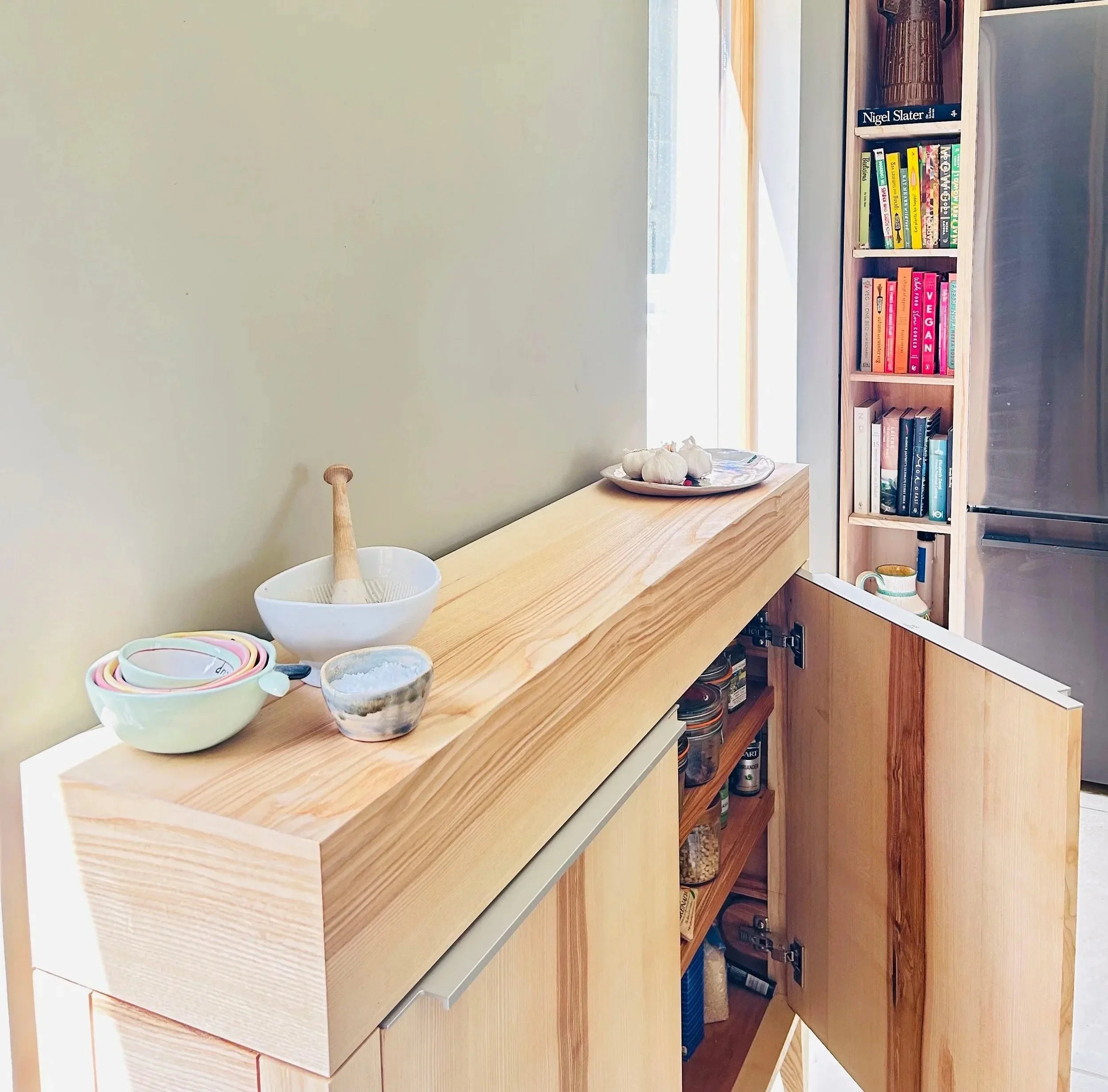 Hand built ash kitchen cabinet with integrated larder and cookbook shelving, made entirely by hand, Bayfolk Furniture North Yorkshire.