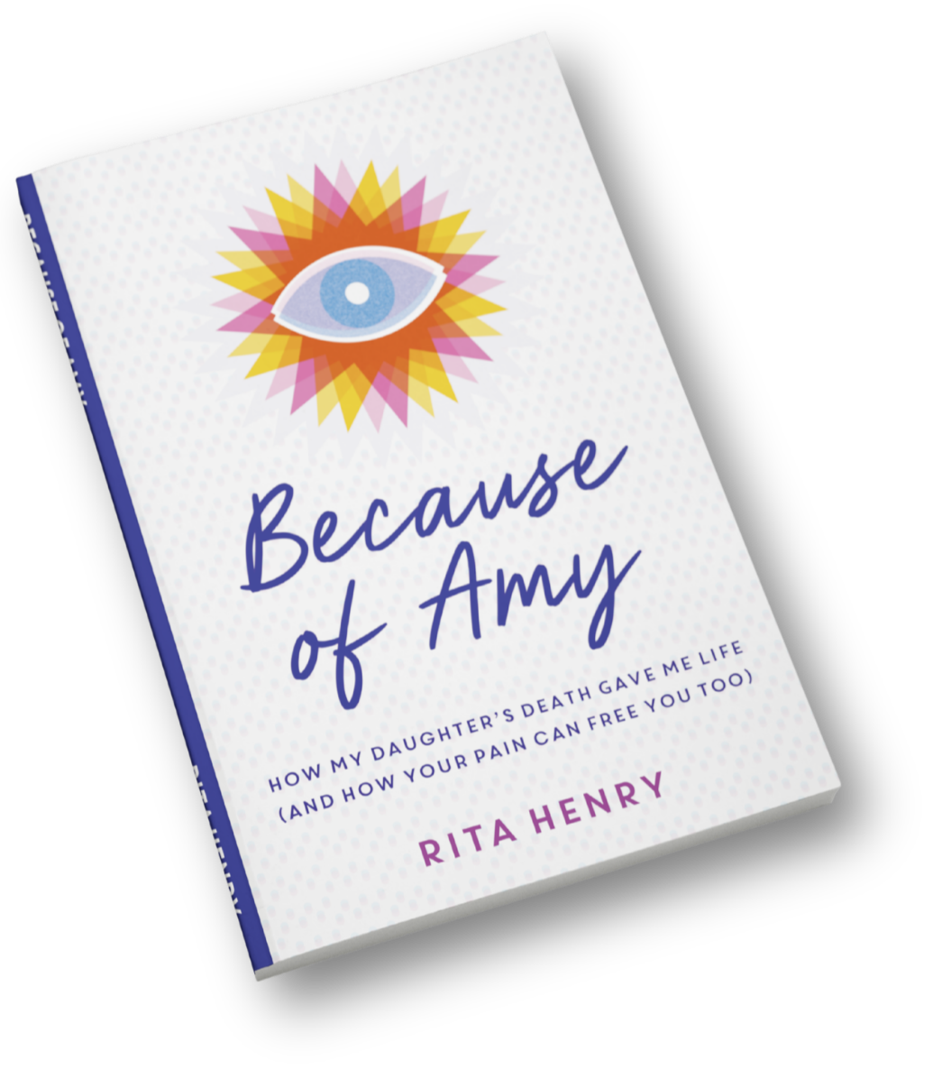 Book titled 'Because of Amy' by Rita Henry with a colorful eye illustration on the cover.