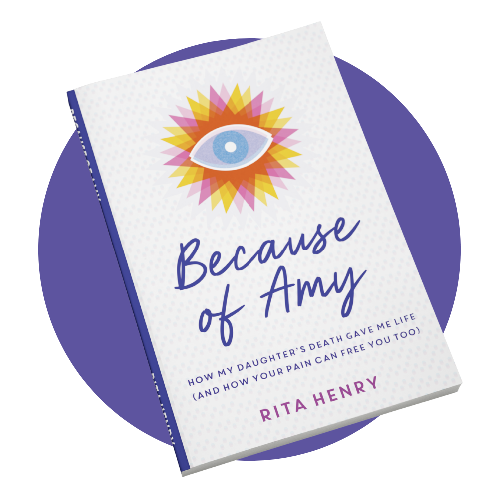 'Because of Amy' by Rita Henry with a book cover illustration of an eye surrounded by colorful geometric shapes.