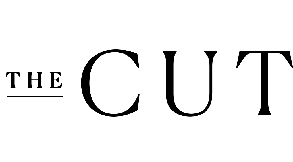The logo for 'The Cut' with stylized black text on a transparent background.
