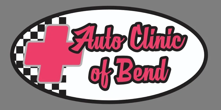 Logo for Auto Clinic of Bend featuring a pink medical cross, a black and white checkerboard pattern, and pink stylized text.
