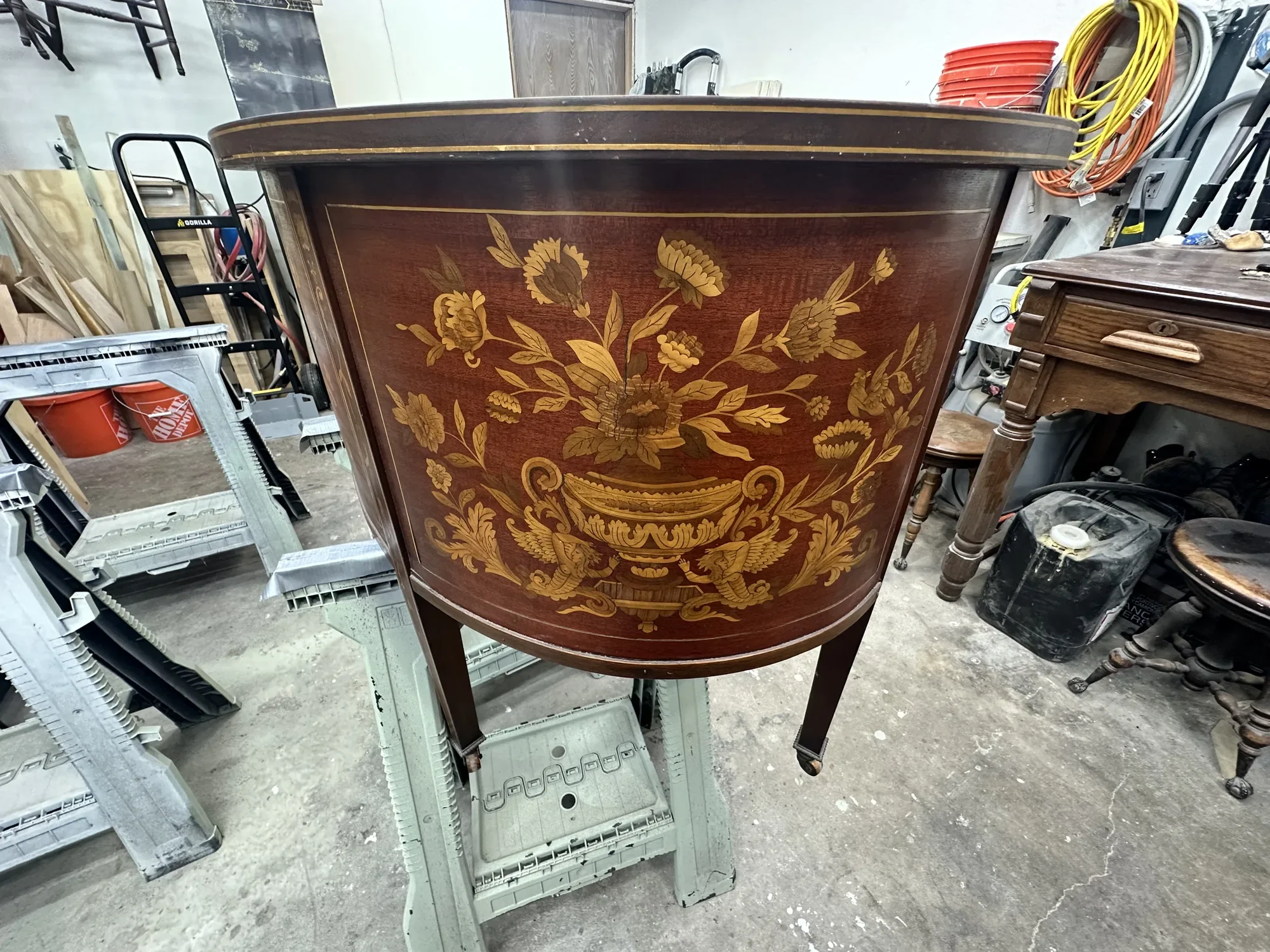 Restored Dutch demilune desk with floral marquetry of an urn of flowers flanked by winged griffins