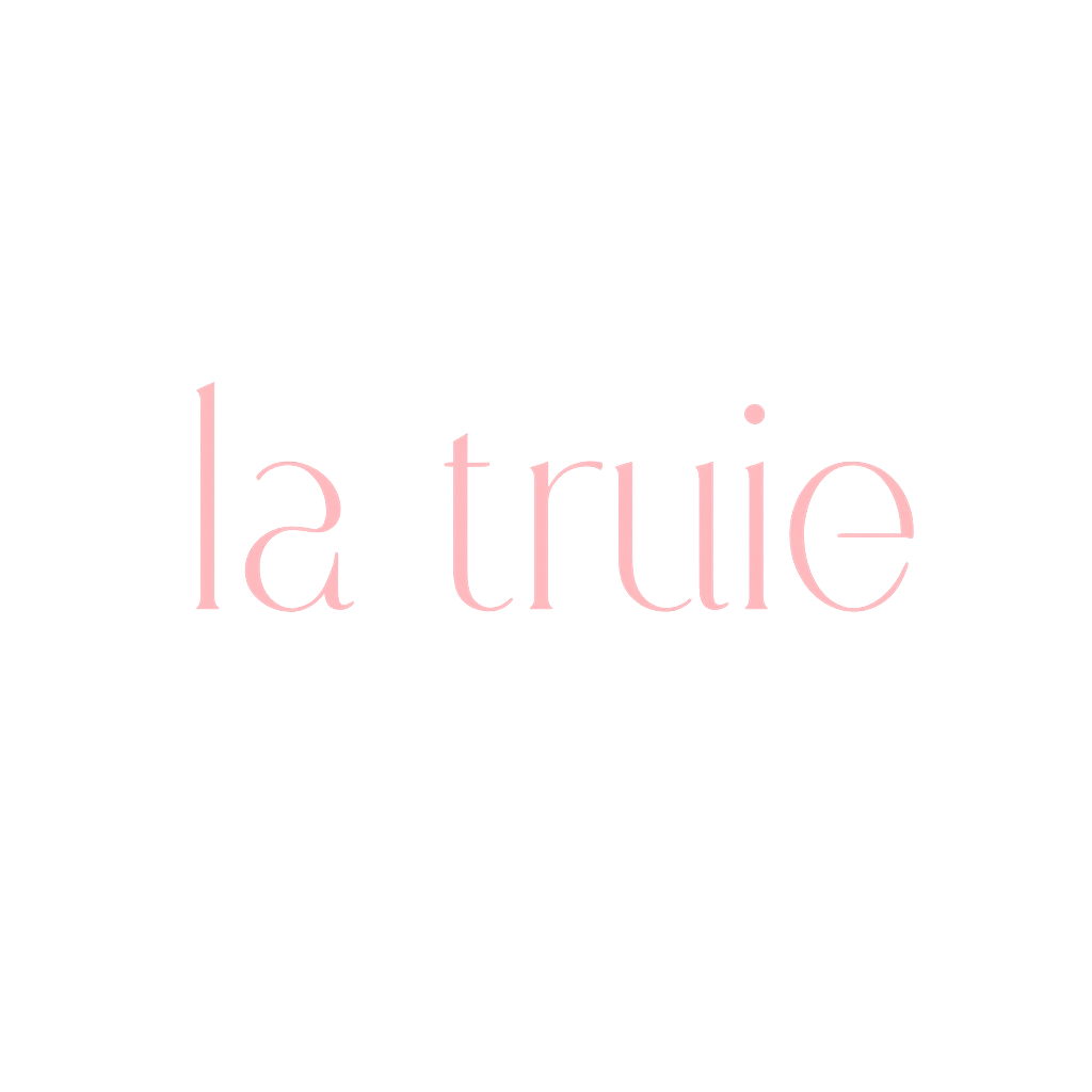 Black background with pink text that says "la true".
