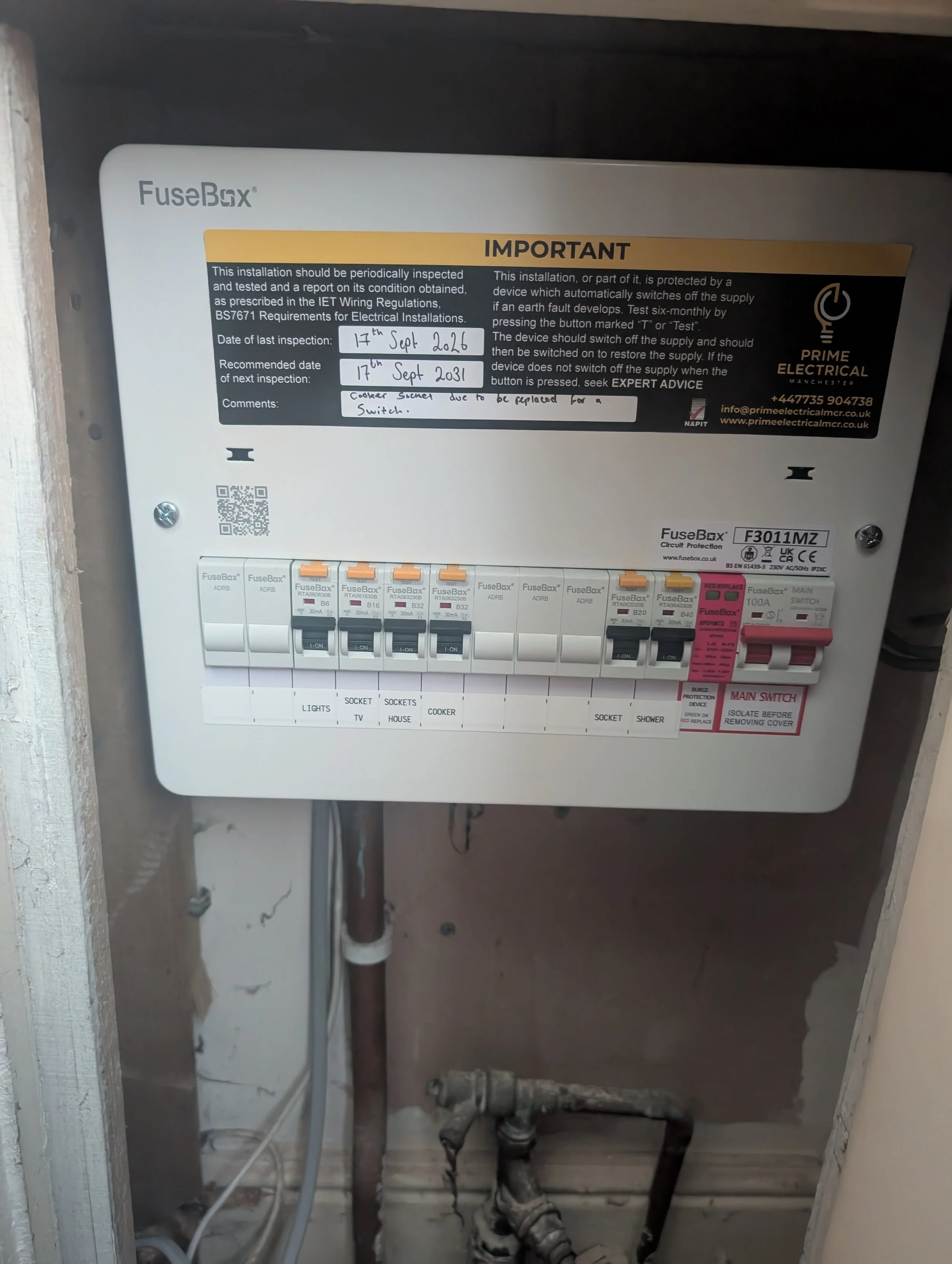 Electrician installing new consumer unit in manchester