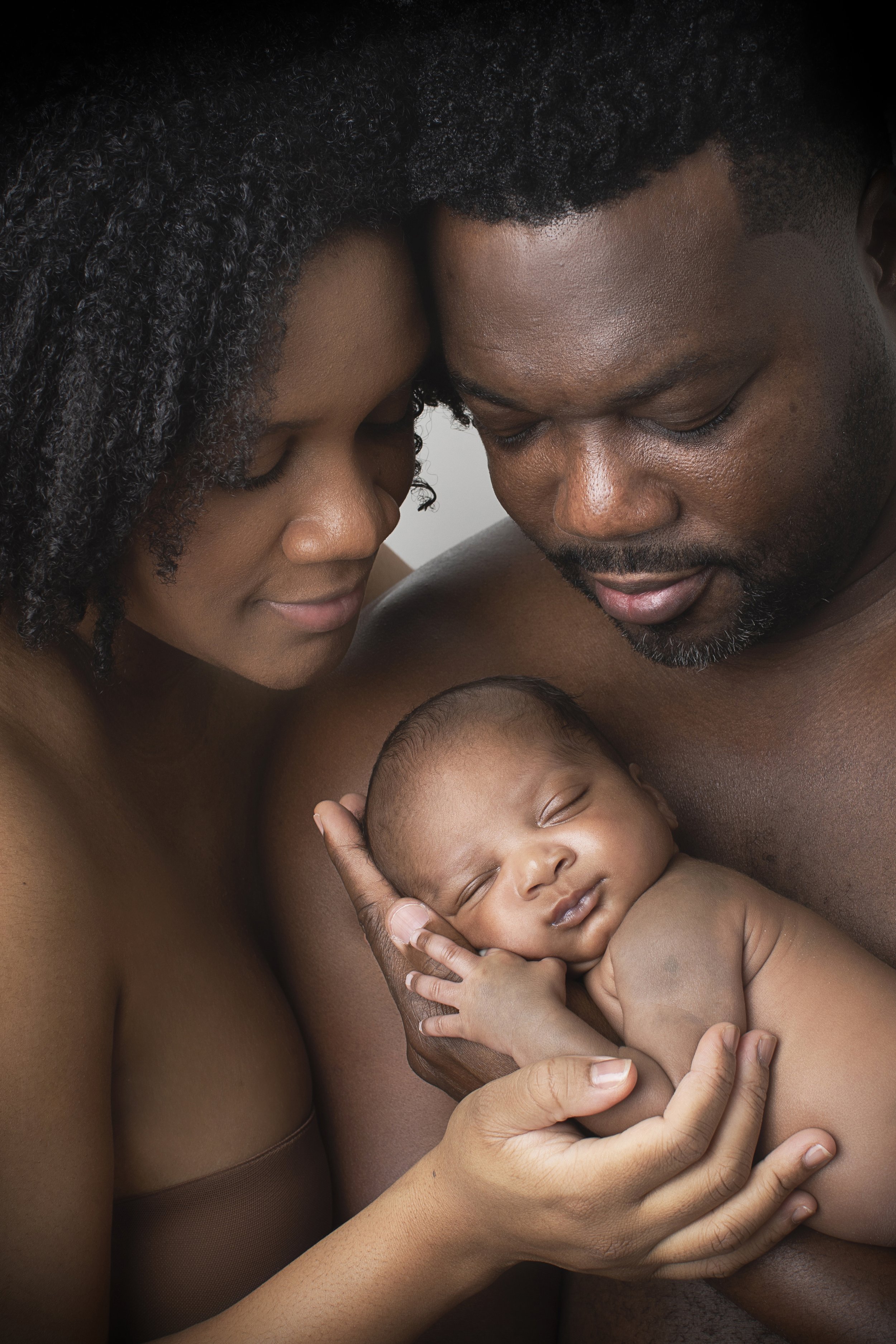 naked newborn session with mom and dad