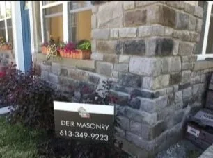 Corner+House+Stone+Wall+with+Sign.jpg