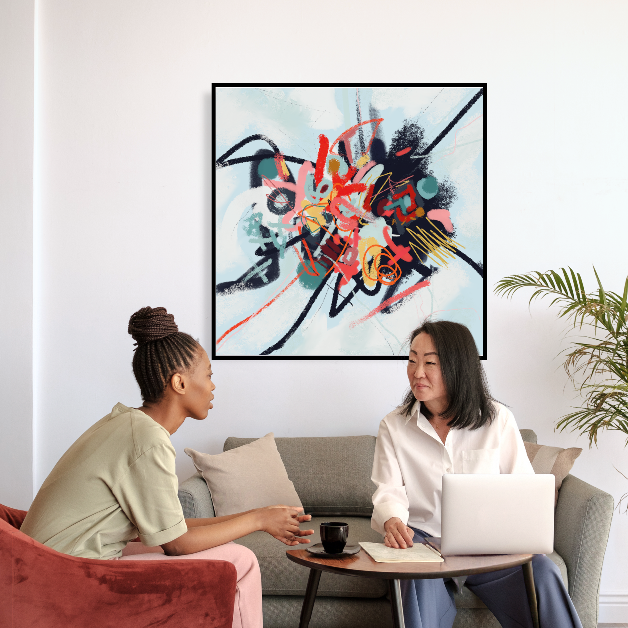 A large abstract painting called 'Soul Searching' by Emily Whitish hangs behind a therapist and her client in a modern therapist office.