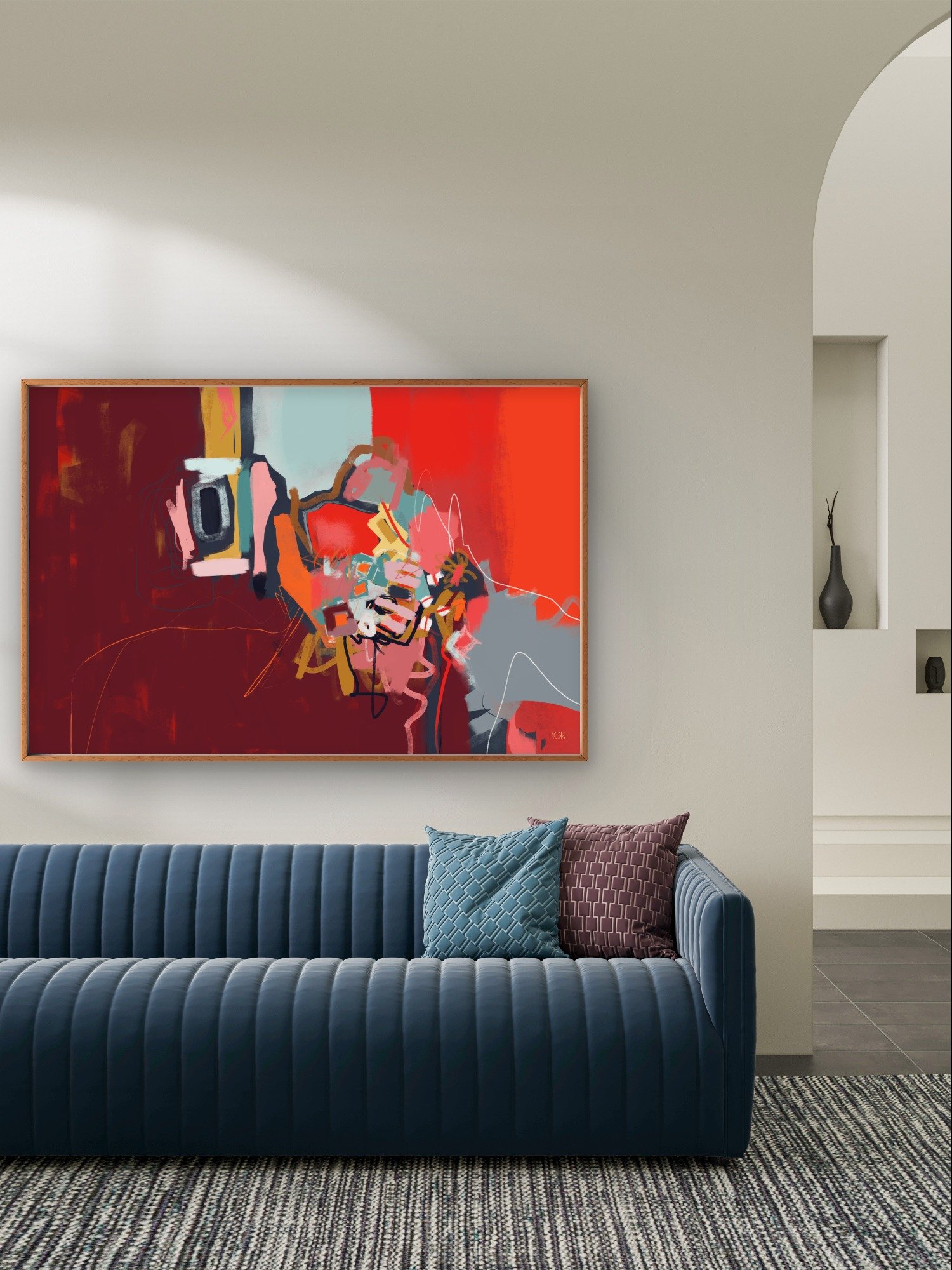 Living room with a blue velvet sofa decorated with blue and brown pillows, a colorful abstract art painting called 'I Hope I Don't Forget' by Emily Whitish.