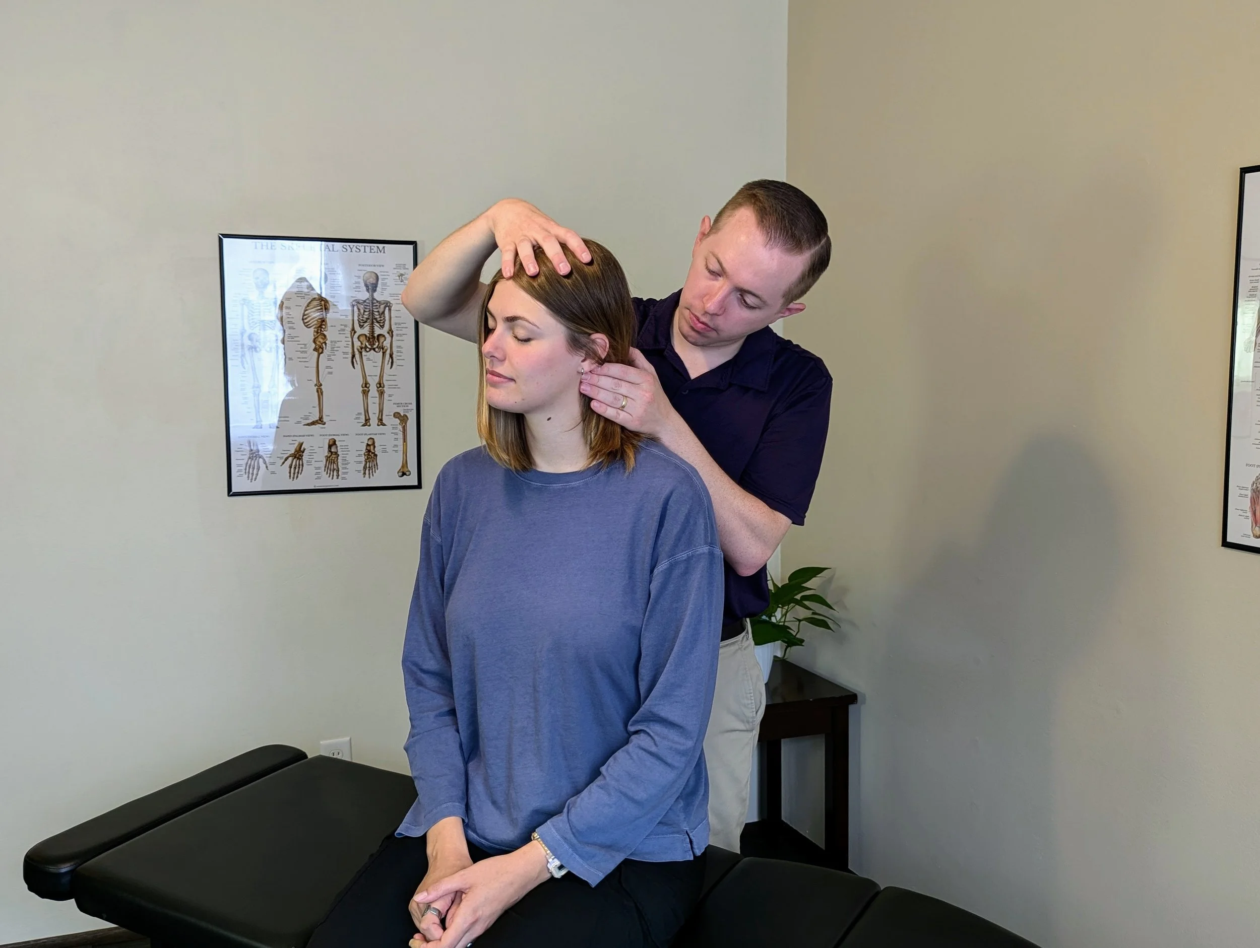 Mother receiving upper cervical chiropractic adjustment