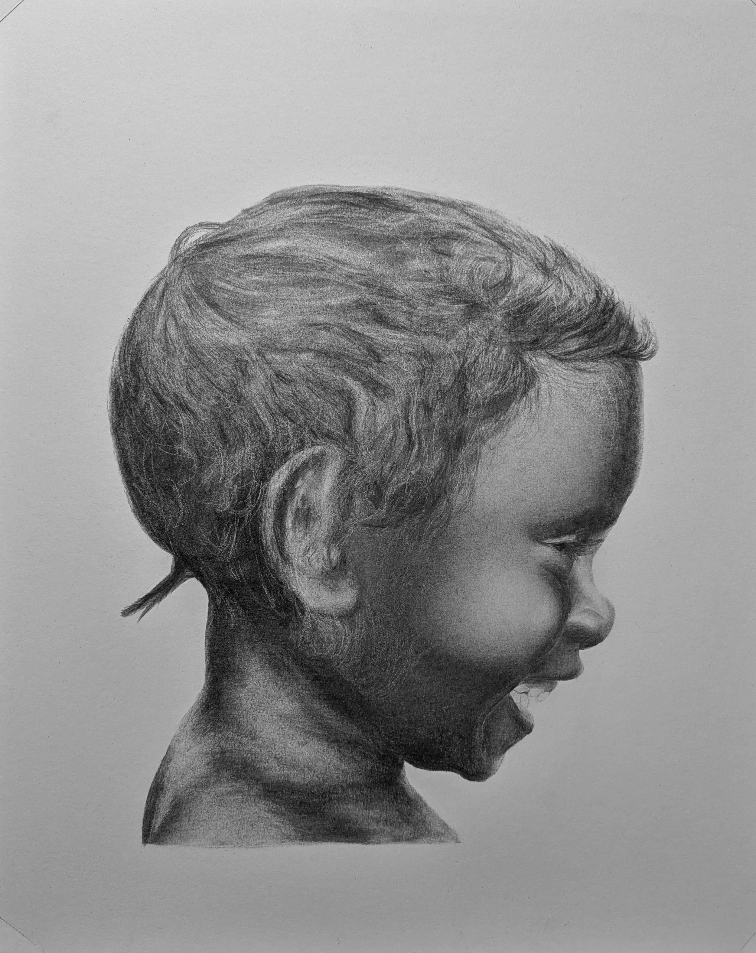 A black and white photorealistic charcoal drawing of a young girl's side profile focusing on the head and upper neck, with detailed hair and facial features.