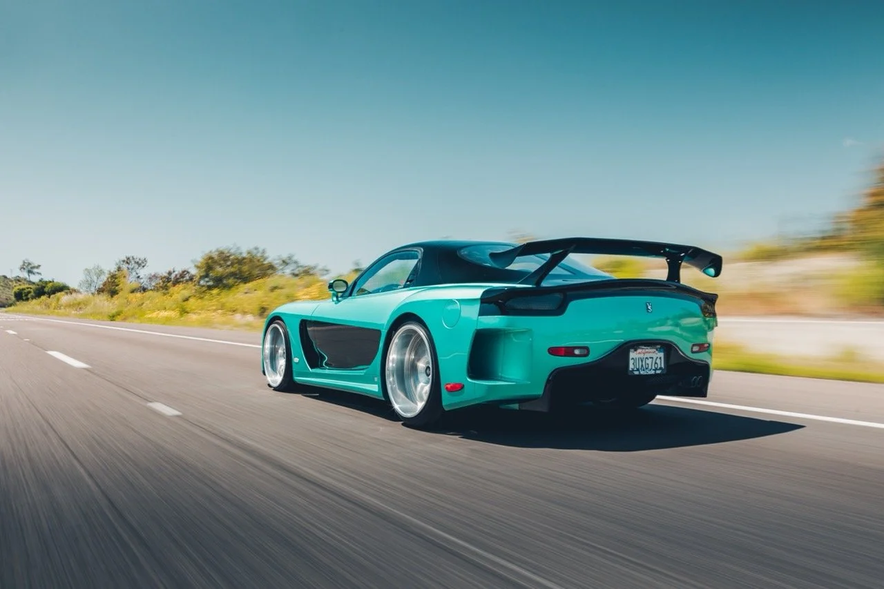 Rolling shot of a Veilside RX7.