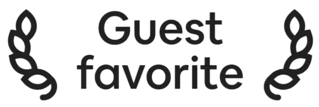 Decorative sign that reads "Guest favorite" with black laurel leaf designs on either side.