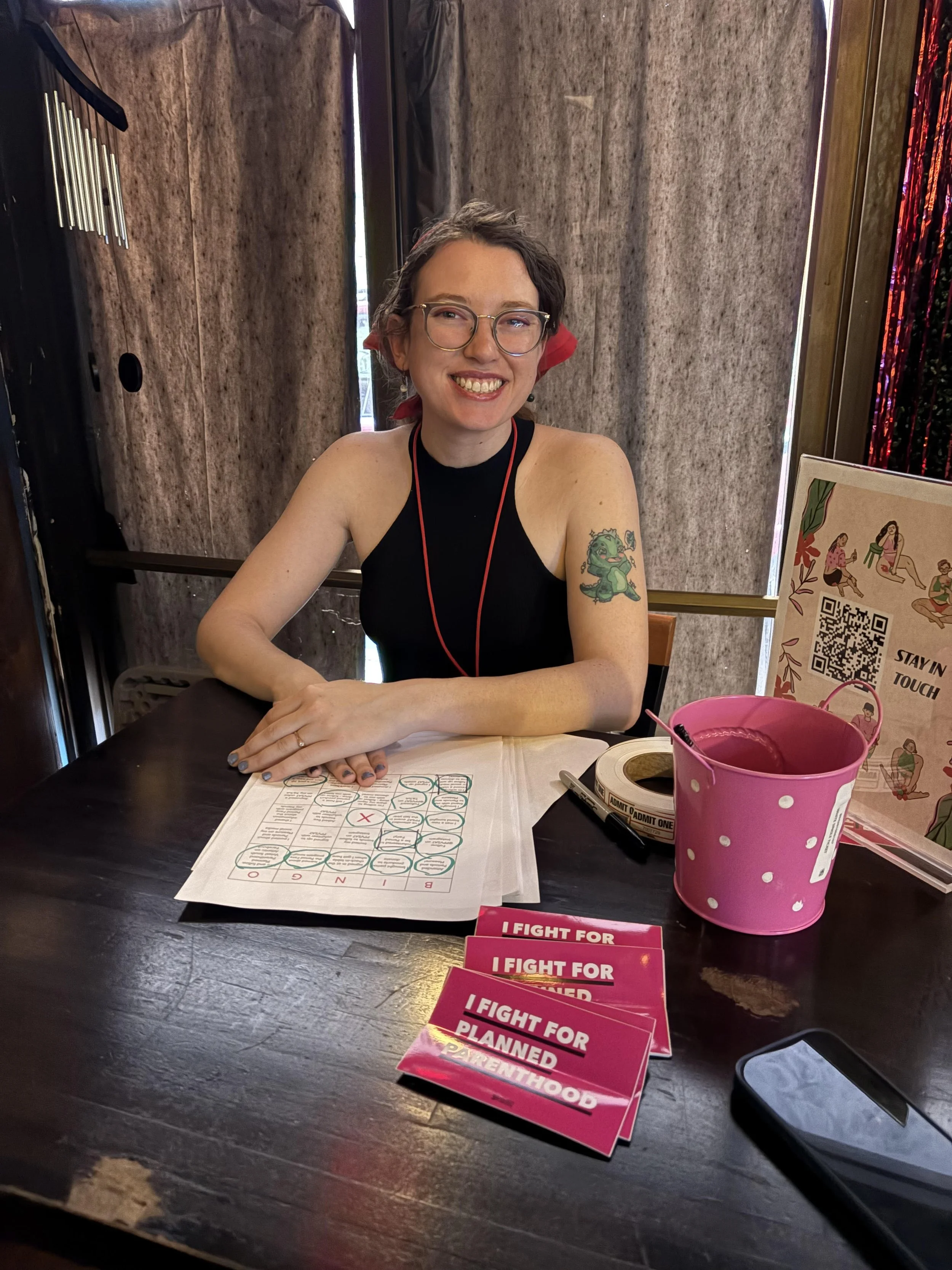 Paige Reiring smiles while working at a Planned Parenthood bingo event in downtown Morgantown.