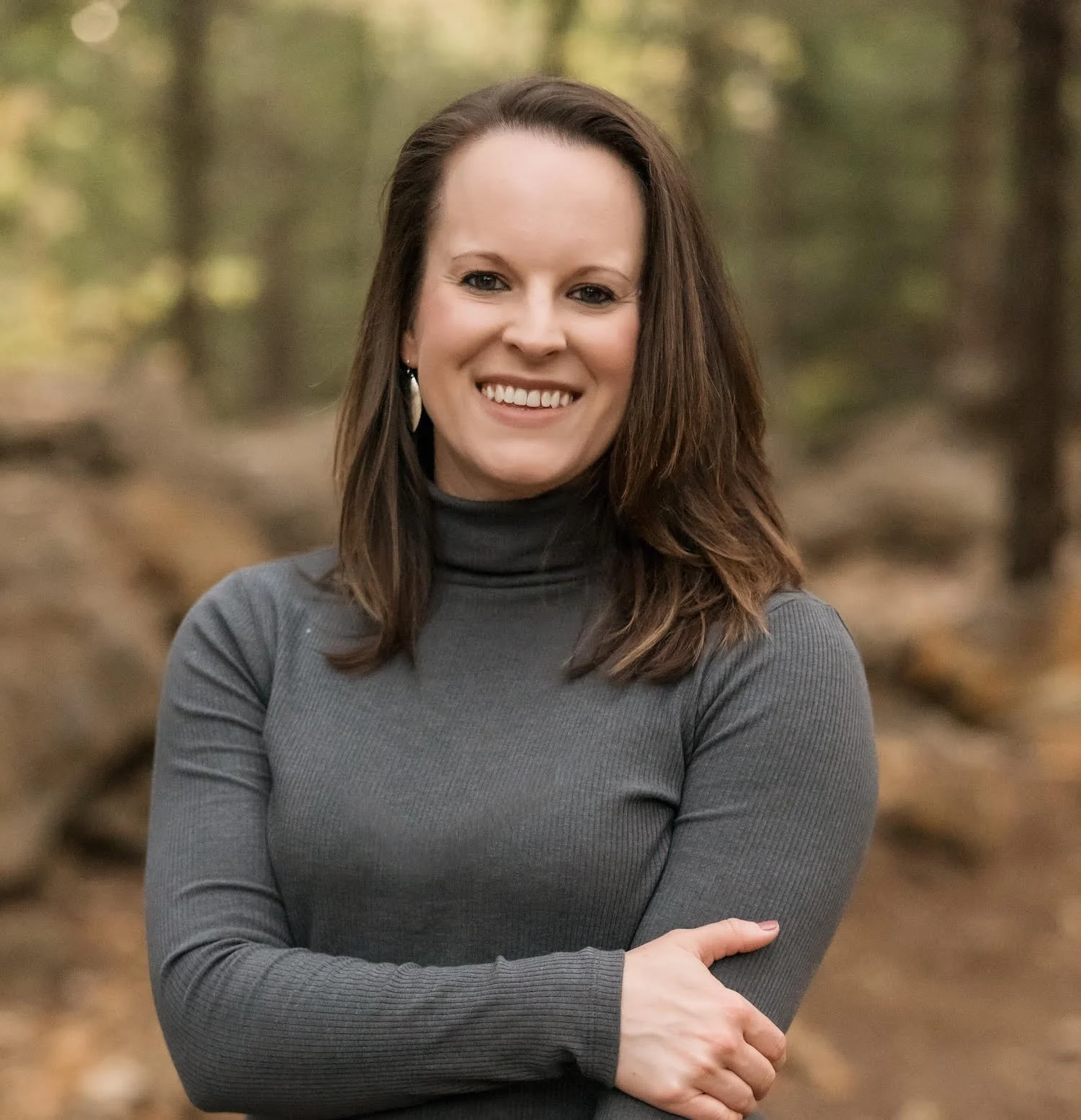 An outdoor photograph of Amanda Ball, M.S., CCC-SLP, owner and speech therapist at Growing Sounds Speech and Language Therapy in Olathe, KS