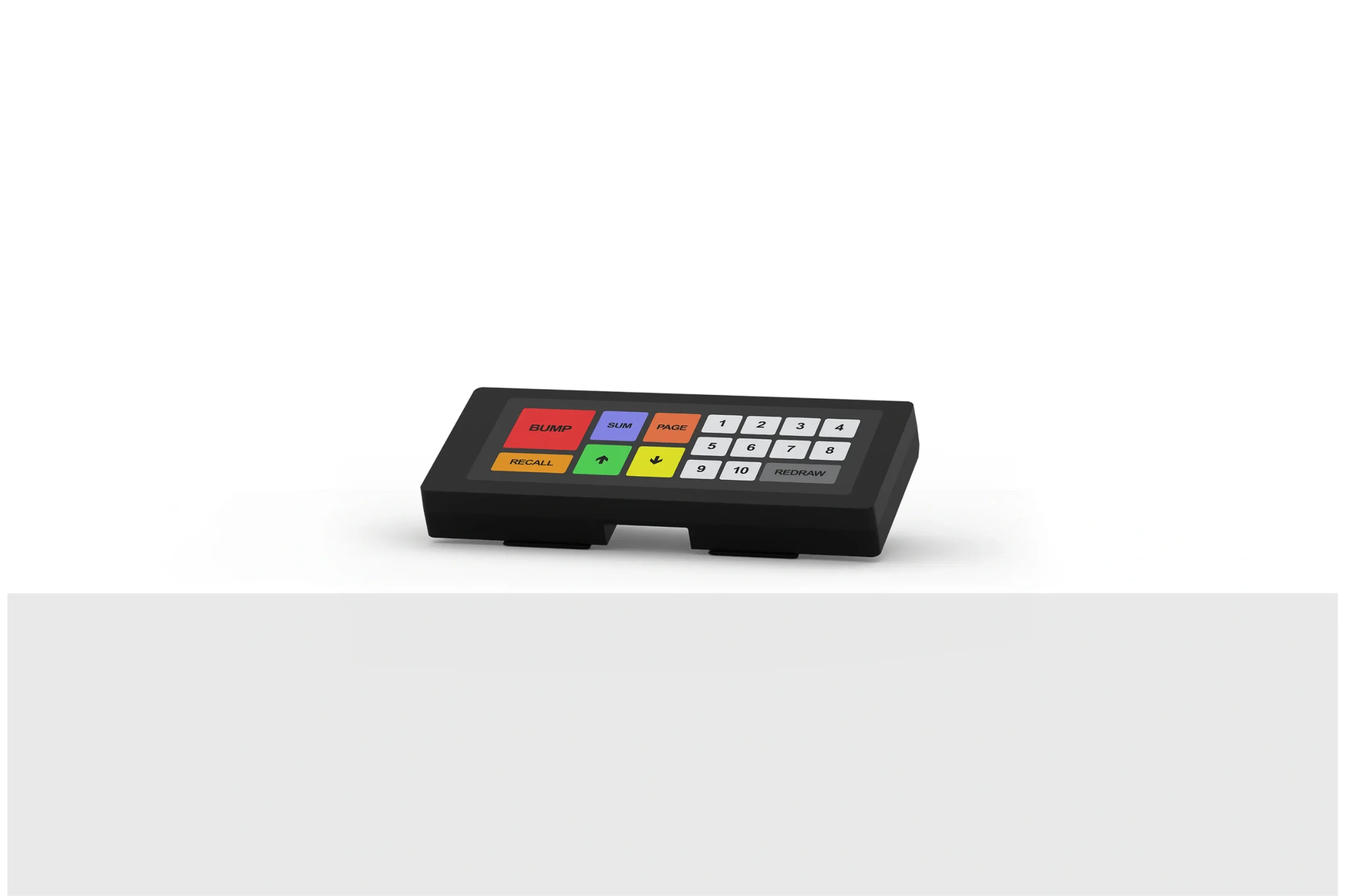 A small electronic device with colorful buttons placed on a white surface.