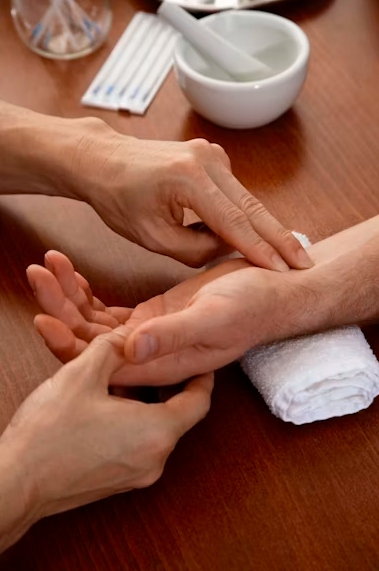 Person having their pulse felt at the wrist.