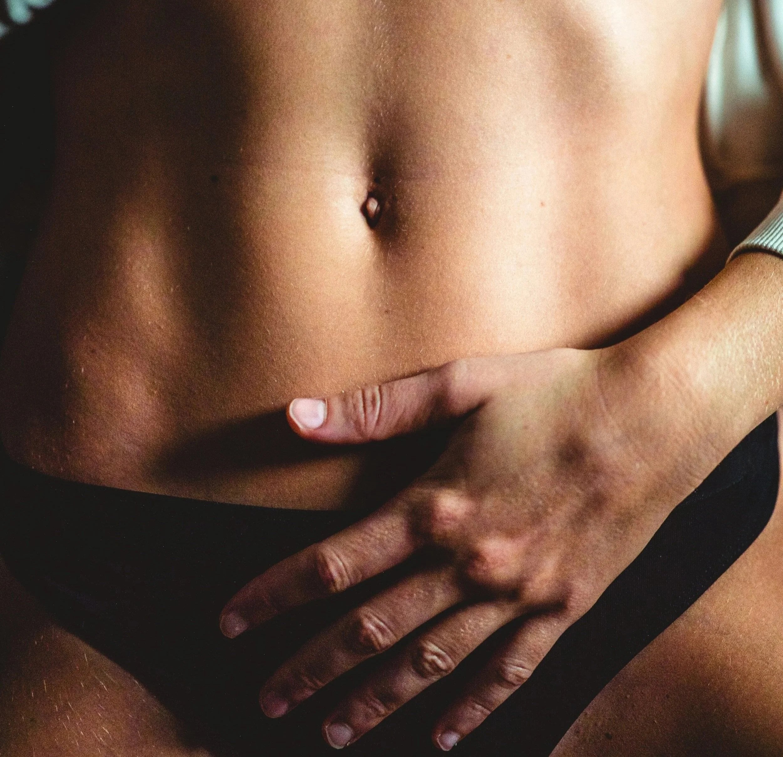Close-up view of a person's abdomen