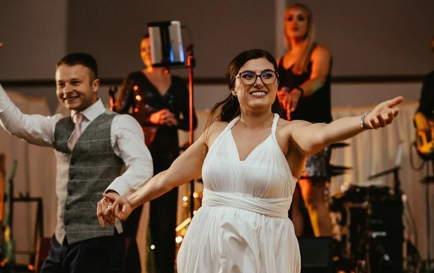 Bride and groom dancing at their wedding with live music from Revolve Party Band