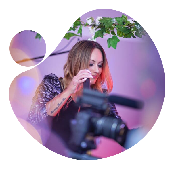 Revolve vocalist performing live at a function with a videographer filming