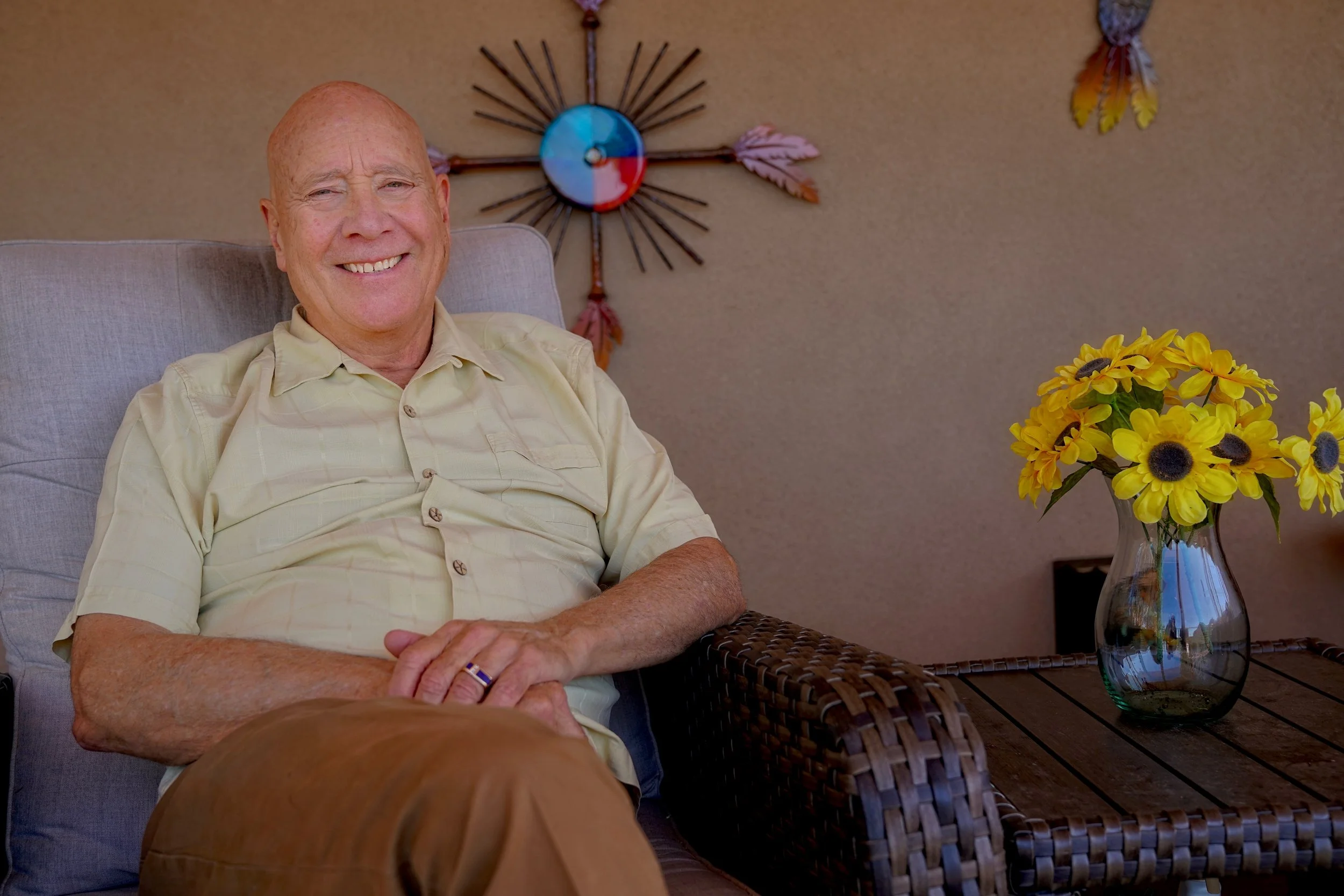 Greg Kiper, LMHC, LPC, seated outdoors in Sedona, Arizona