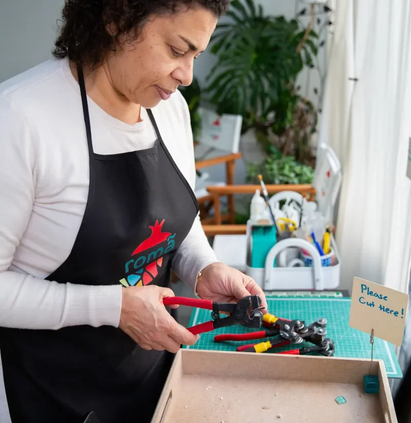 Mosaic artist Azza assembling tiles in her studio