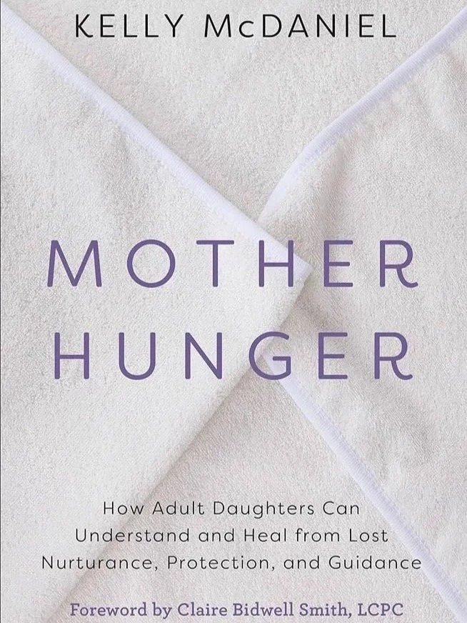 Book cover titled "Mother Hunger" by Kelly McDaniel with a light-colored fabric background and purple text.