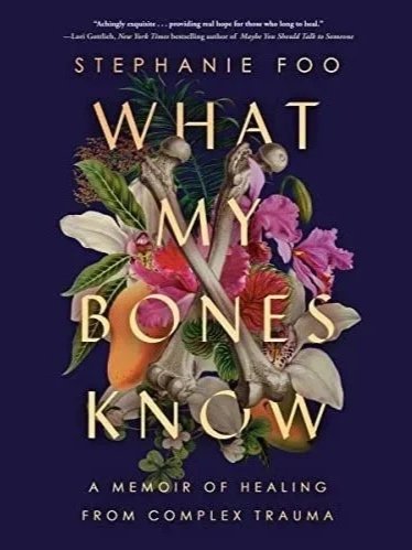 Book cover for "What My Bones Know" by Stephanie Foo, featuring a colorful arrangement of flowers and bones on a dark background.