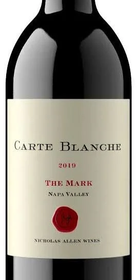 A wine bottle labeled 'Carte Blanche 2019 The Mark Napa Valley' with a red wax seal.