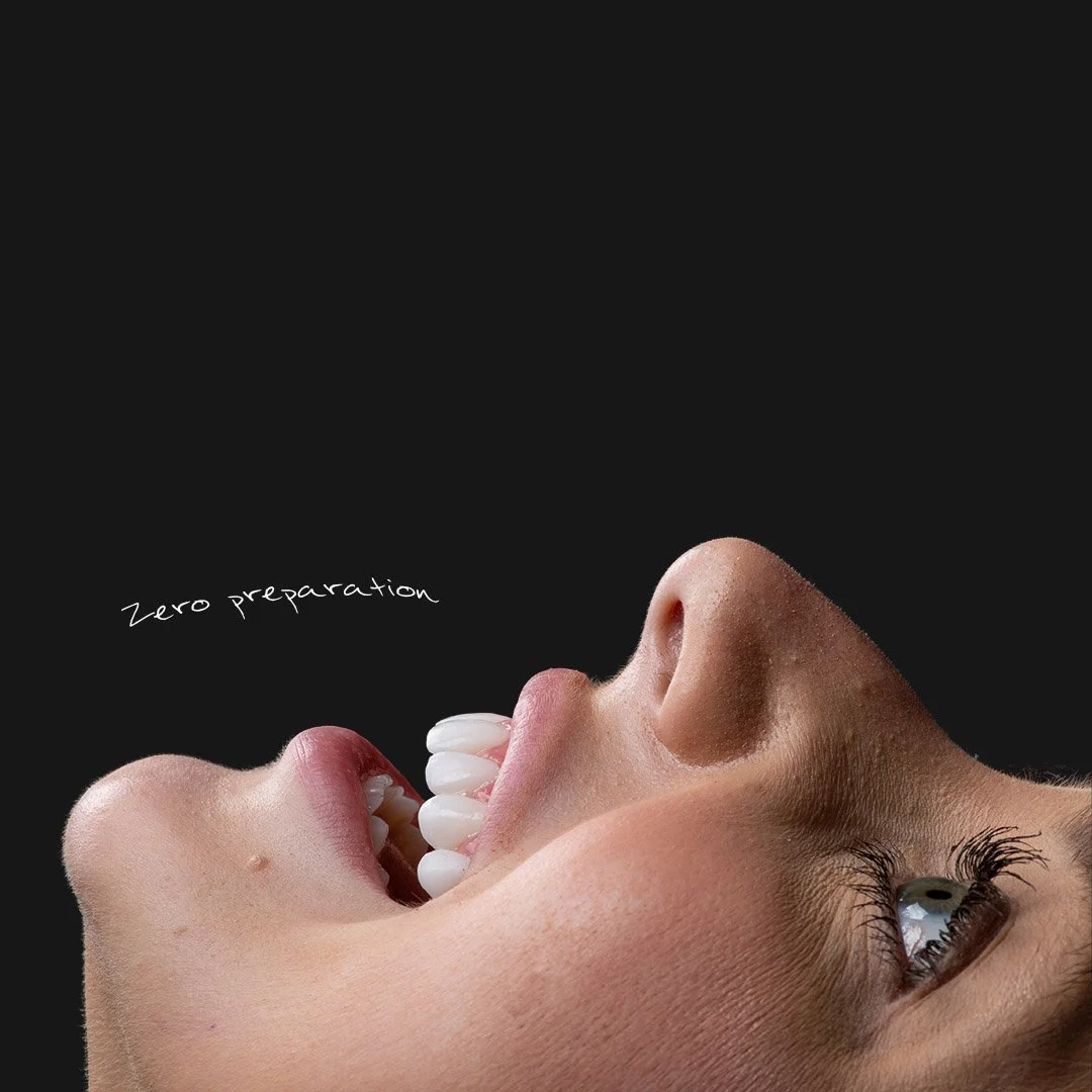 Close-up of a person's face with the mouth open, showing teeth and tongue, and the eye visible, against a black background. The phrase 'Zero preparation' is written next to the face.